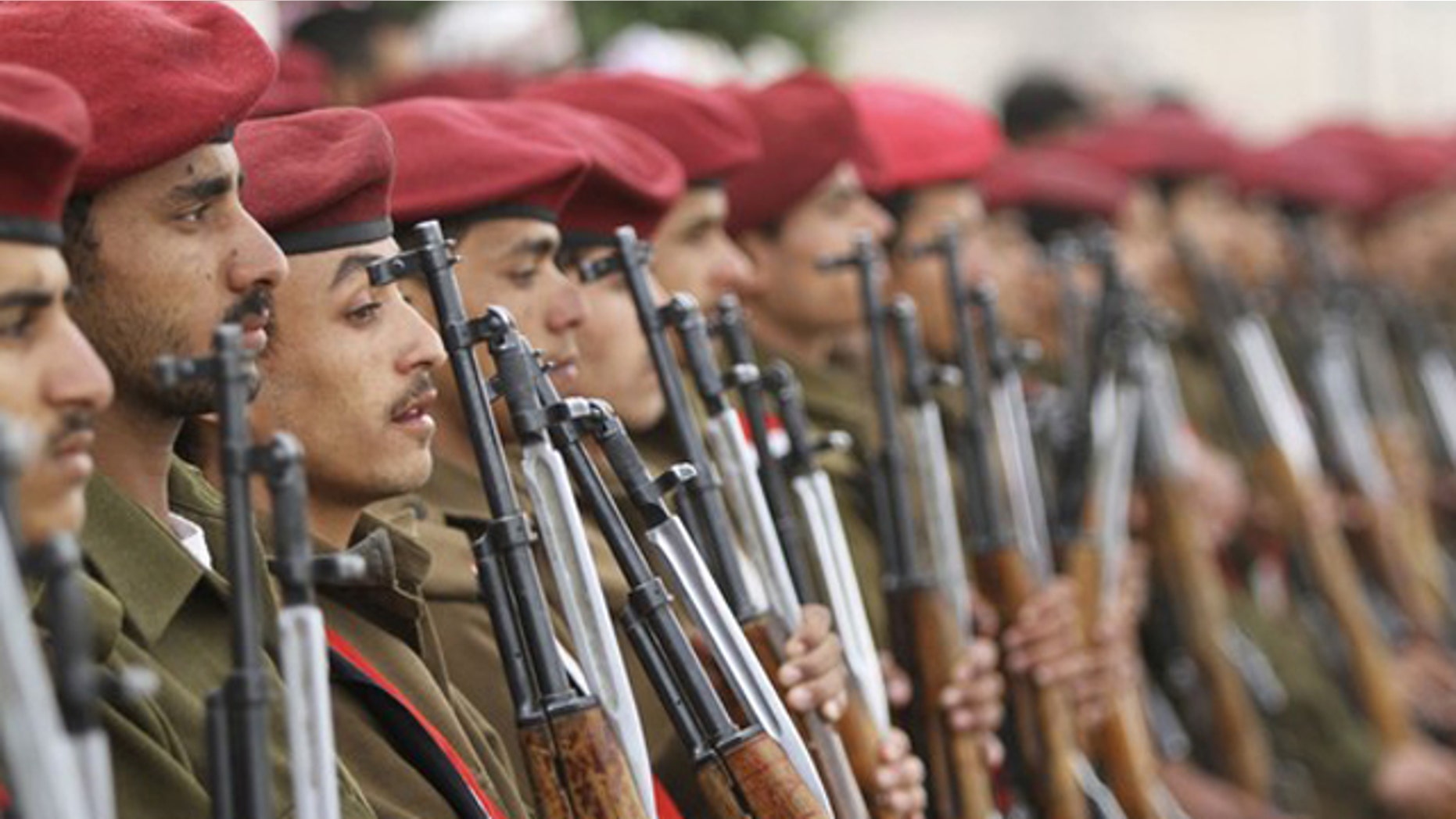 Feb. 27, 2012: Soldiers line up during a funeral procession for Republican Guards killed in a suicide car bomb attack in southern Yemen.