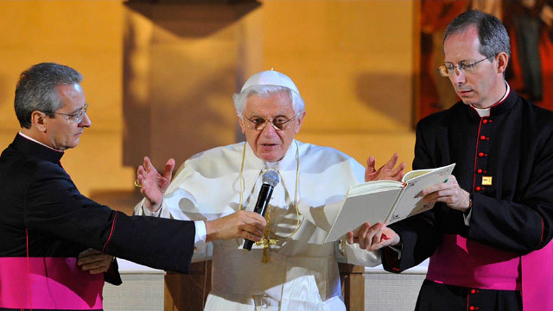 Pope Benedict XVI, right, attends a Service of Prayer at St Mary's University College Chapel at Twickenham, London Friday Sept. 17, 2010. Thousands of cheering Catholic schoolchildren feted Pope Benedict XVI on his second day in Britain on Friday, offering a boisterous welcome even as the pontiff urged their teachers to make sure to provide a trusting, safe environment.
