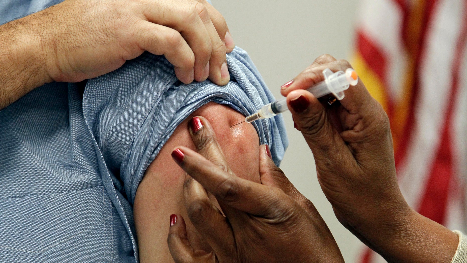 Oct. 17, 2012: This file photo shows a patient getting a flu shot in Jackson, Miss.