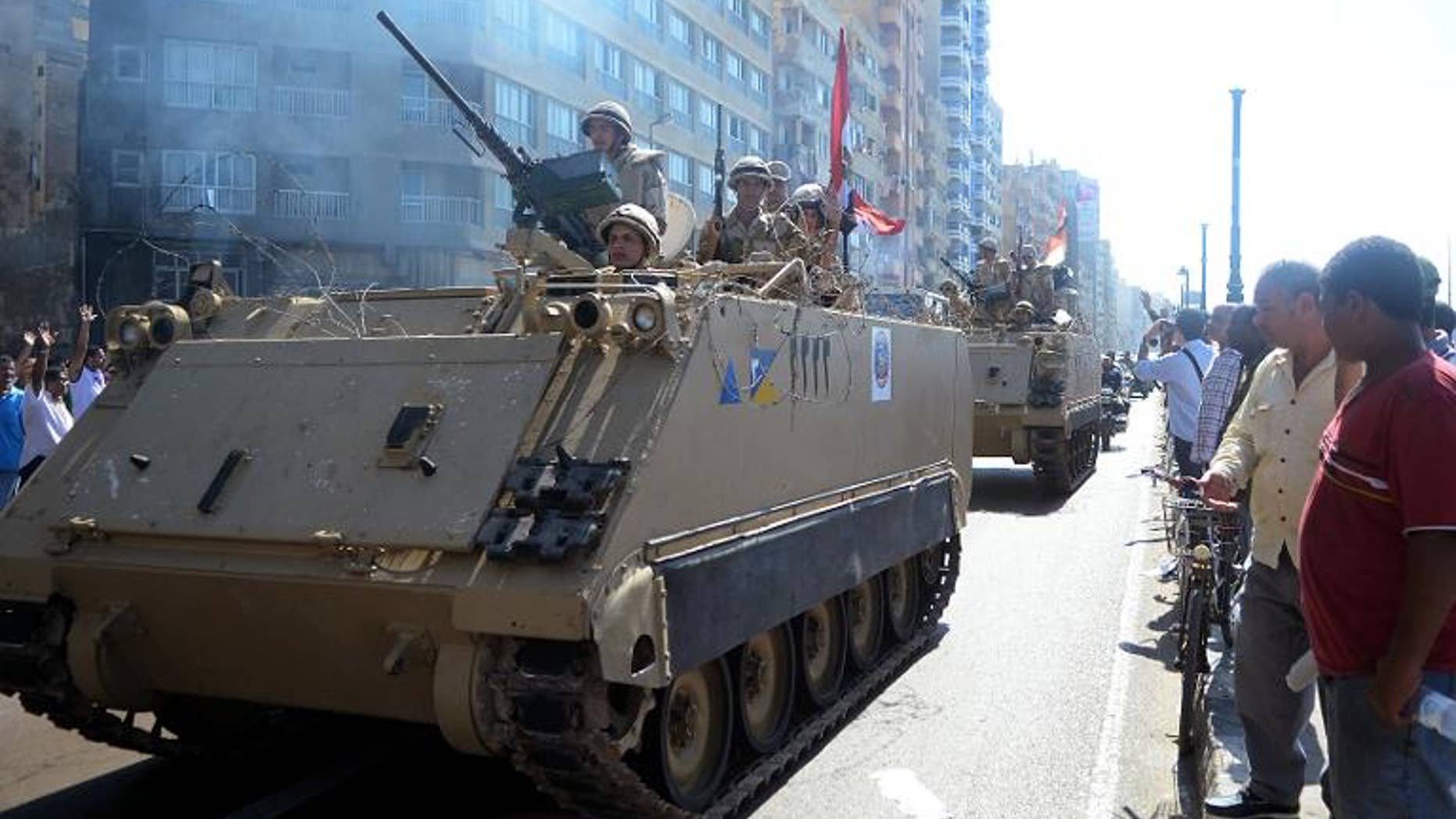 Egyptian security forces patrol the seafront in Alexandria during a demonstration in support of ousted Islamist president Mohamed Morsi, September 20, 2013