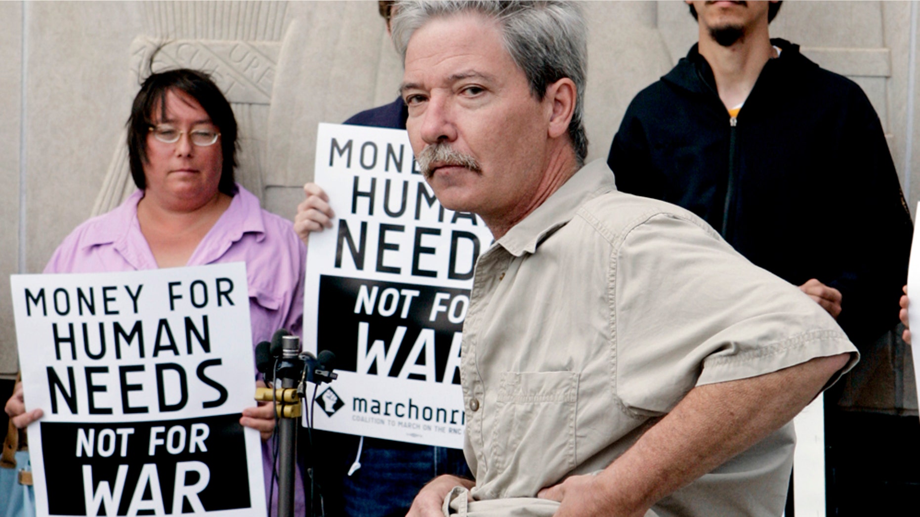 FILE - In this Sept. 4, 2008 file photo, Mick Kelly shows off the bruise at a news conference in St. Paul, Minn., that he said he received after getting hit by a projectile fired by riot police as anti-war protesters gathered near the State Capitol in St. Paul where the Republican National Convention was nearing an end. (AP Photo/Jim Mone, File)