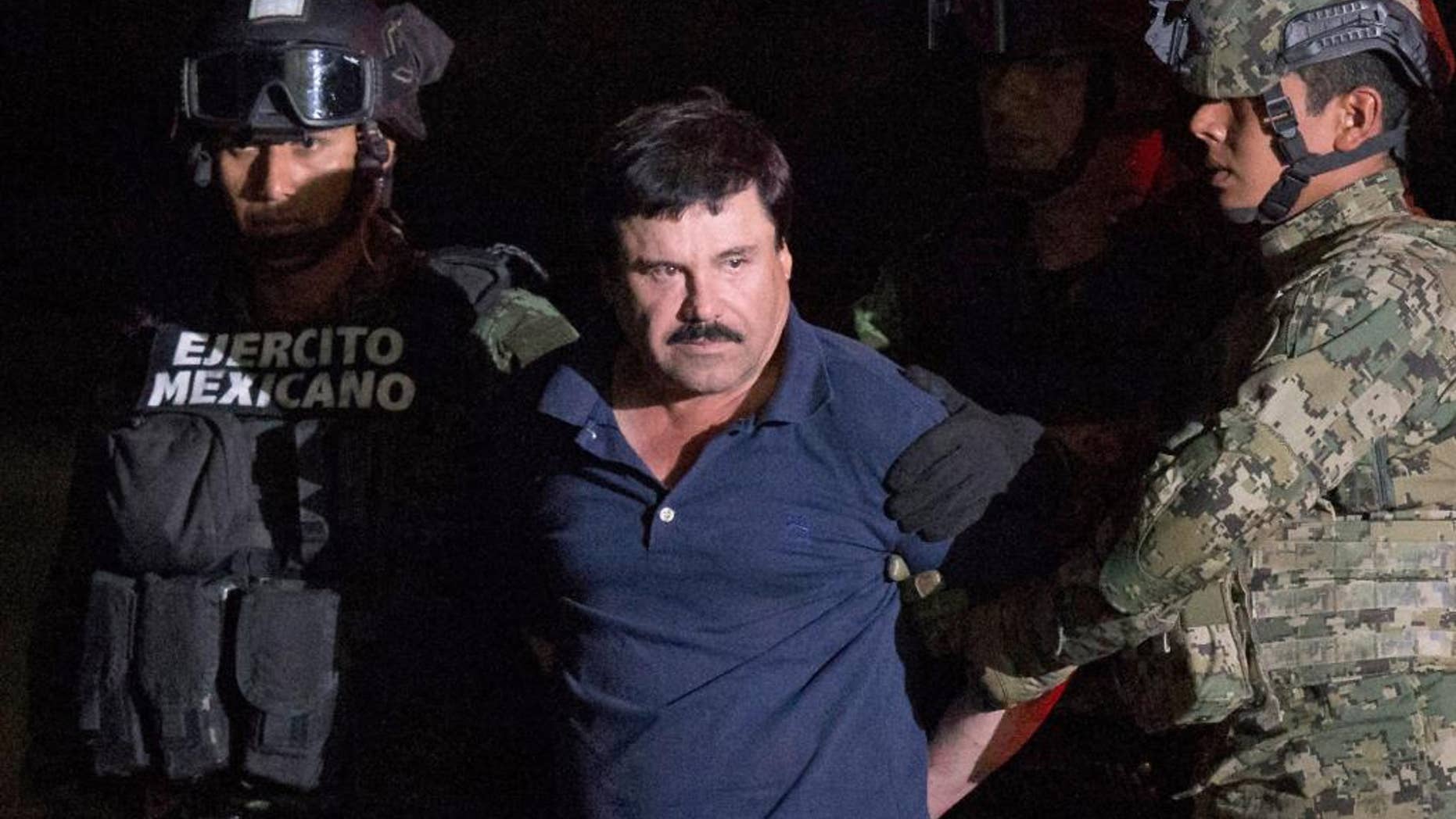 FILE - In this Jan. 8, 2016 file photo, Mexican drug lord Joaquin "El Chapo" Guzman is escorted by army soldiers to a waiting helicopter, at a federal hangar in Mexico City, after he was recaptured from breaking out of a maximum security prison in Mexico. The History channel says it's developing a drama series focusing on Guzman's story. Last year, Guzman had broken out of prison and was on the run when he had a secret meeting with Mexican actress Kate del Castillo and Sean Penn. The actor wrote about it for Rolling Stone. (AP Photo/Rebecca Blackwell, File)