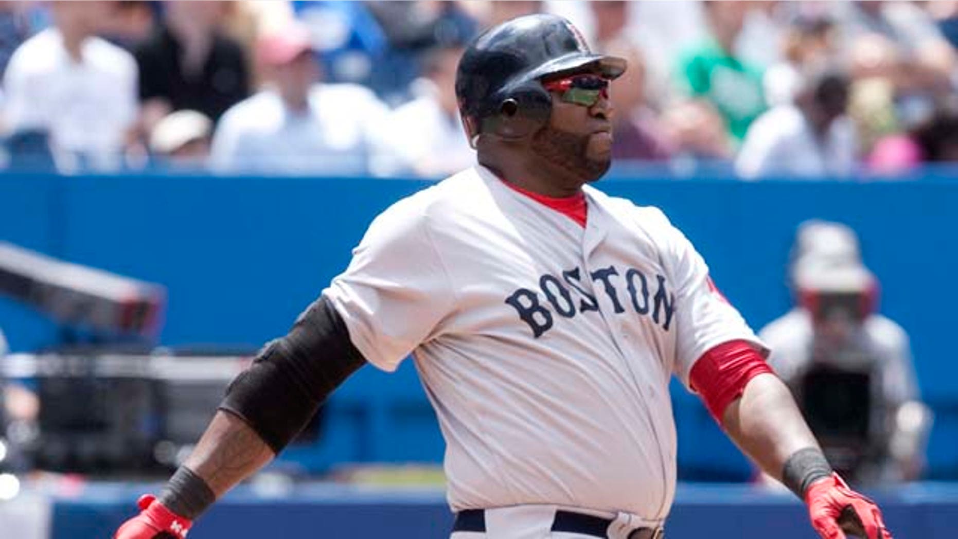 Boston Red Sox's David Ortiz hits a three-run home run in the fifth inning of MLB baseball game action against the Toronto Blue Jays in Toronto, Sunday, June 12, 2011. (AP Photo/The Canadian Press, Darren Calabrese)