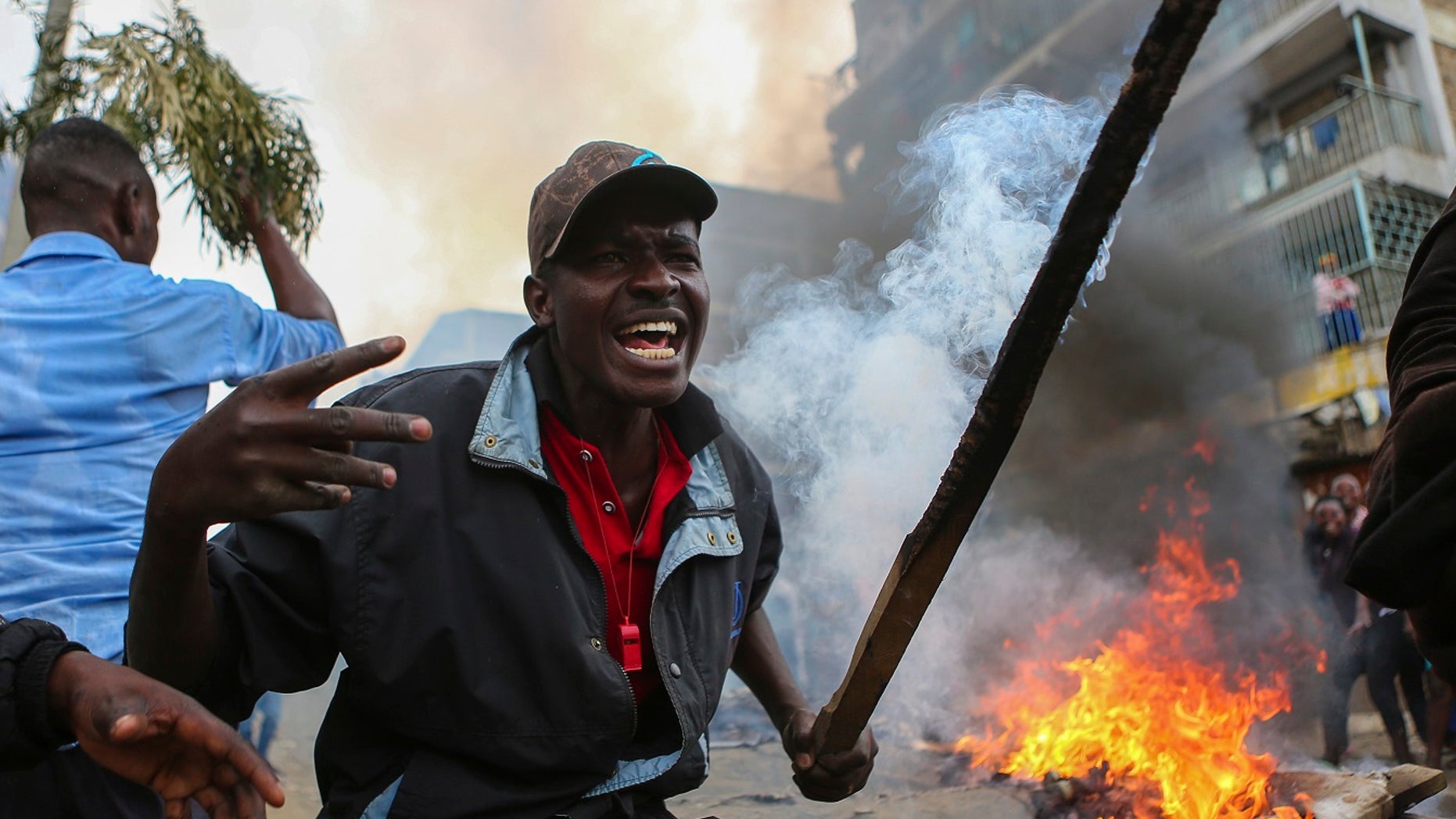Residents of the Mathare area of Nairobi, Kenya, take to the streets by blocking roads with burning tires to protest in support of Kenyan opposition leader and presidential candidate Ralia Odinga.