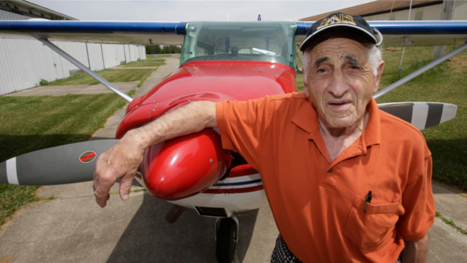 May 30, 2013: John Lawton poses by his Cessna 172 airplane in Wadsworth, Ohio. Lawton will attempt to make 90 flying passages across the U.S.-Canadian border.