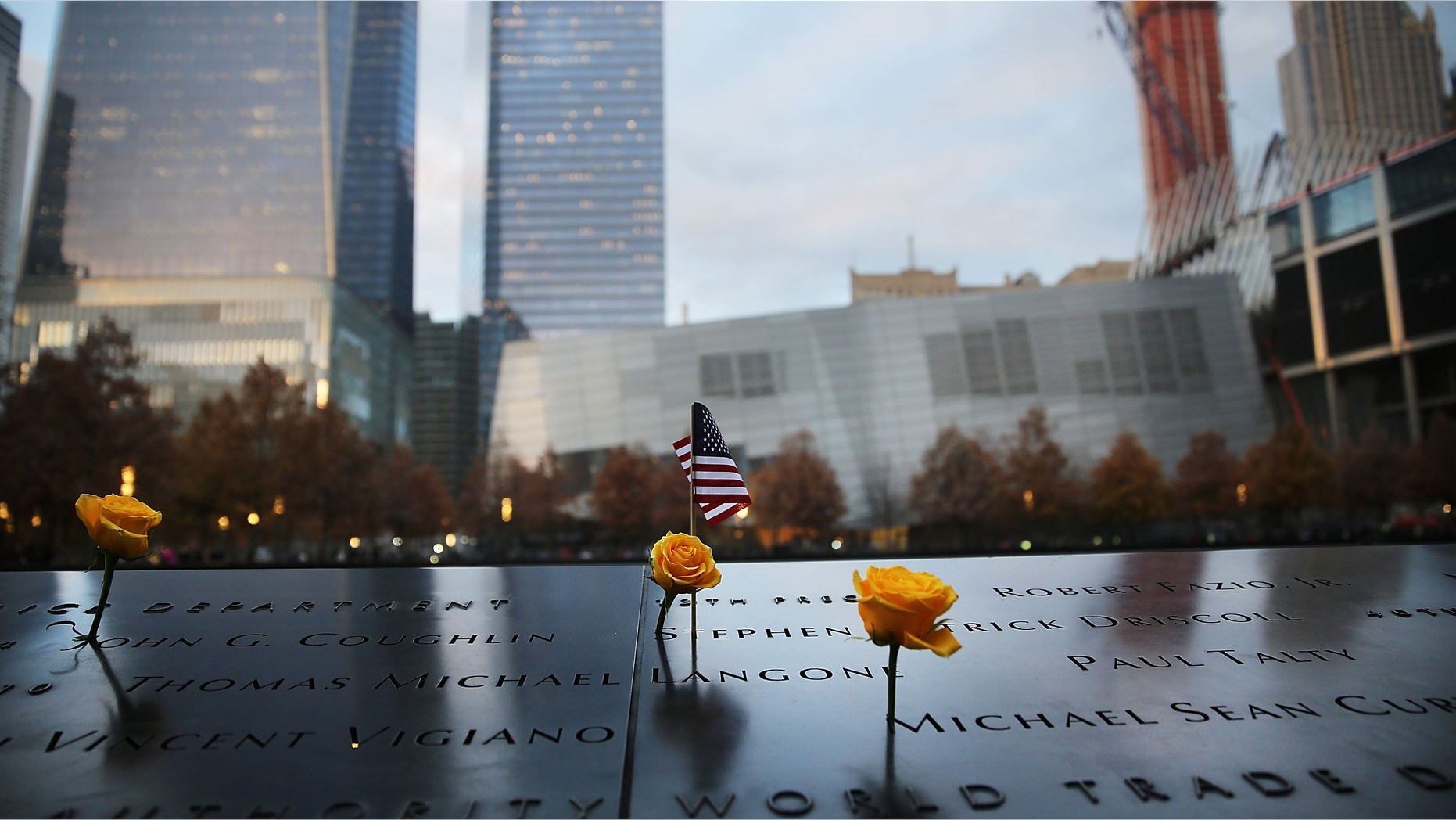 NEW YORK, NY - NOVEMBER 11: Flowers are viewed at the 9/11 Memorial where flowers are placed on the names of veterans killed on September 11, 2001 for Veterans Day in New York on November 11, 2014 in New York City. New York celebrated the day with the annual Veteran's Day Parade, which is often called the largest Veteran's Day Parade in the country. (Photo by Spencer Platt/Getty Images)