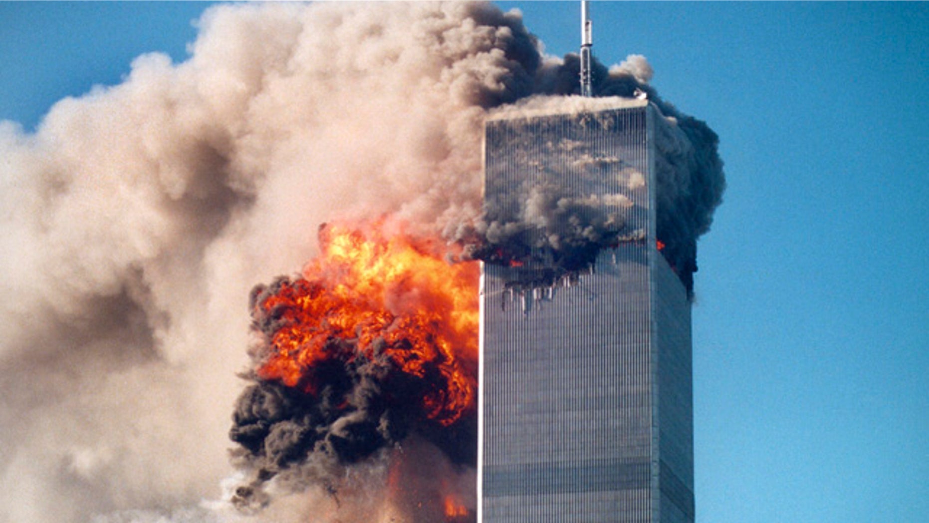 This photo by Roberto Robanne, provided in New York by the National September 11 Memorial & Museum, included in their "September 11 Attacks Timeline," shows the impact of one of the airplanes during the World Trade Center attacks in New York, Sept. 11, 2001. (AP/National September 11 Memorial & Museum)