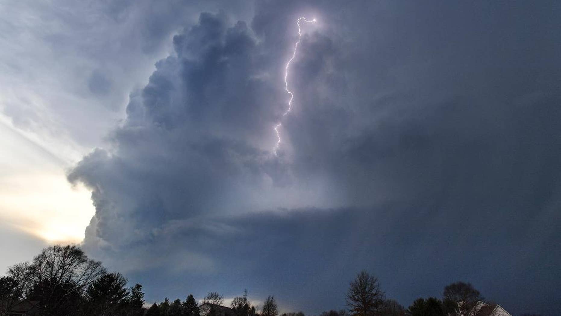 Lightning flashes in storm clouds over the village of Dunlap, Ill., Tuesday, Feb. 28, 2017. A spring-like storm churning across the Midwest poses a risk of more bad weather for millions of people. (Ron Johnson/Journal Star via AP)