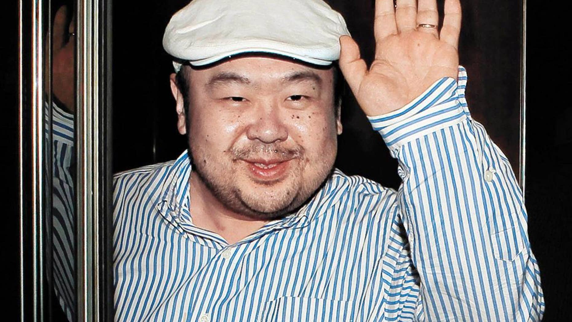 FILE - In this June 4, 2010, file photo, dressed in jeans and blue suede loafers, Kim Jong Nam, the eldest son of then North Korean leader Kim Jong Il, waves after his first-ever interview with South Korean media in Macau. Kim was assassinated at an airport in Kuala Lumpur, telling medical workers before he died that he had been attacked with a chemical spray a Malaysian official said Tuesday. (Shin In-seop/JoongAng Ilbo via AP, File)