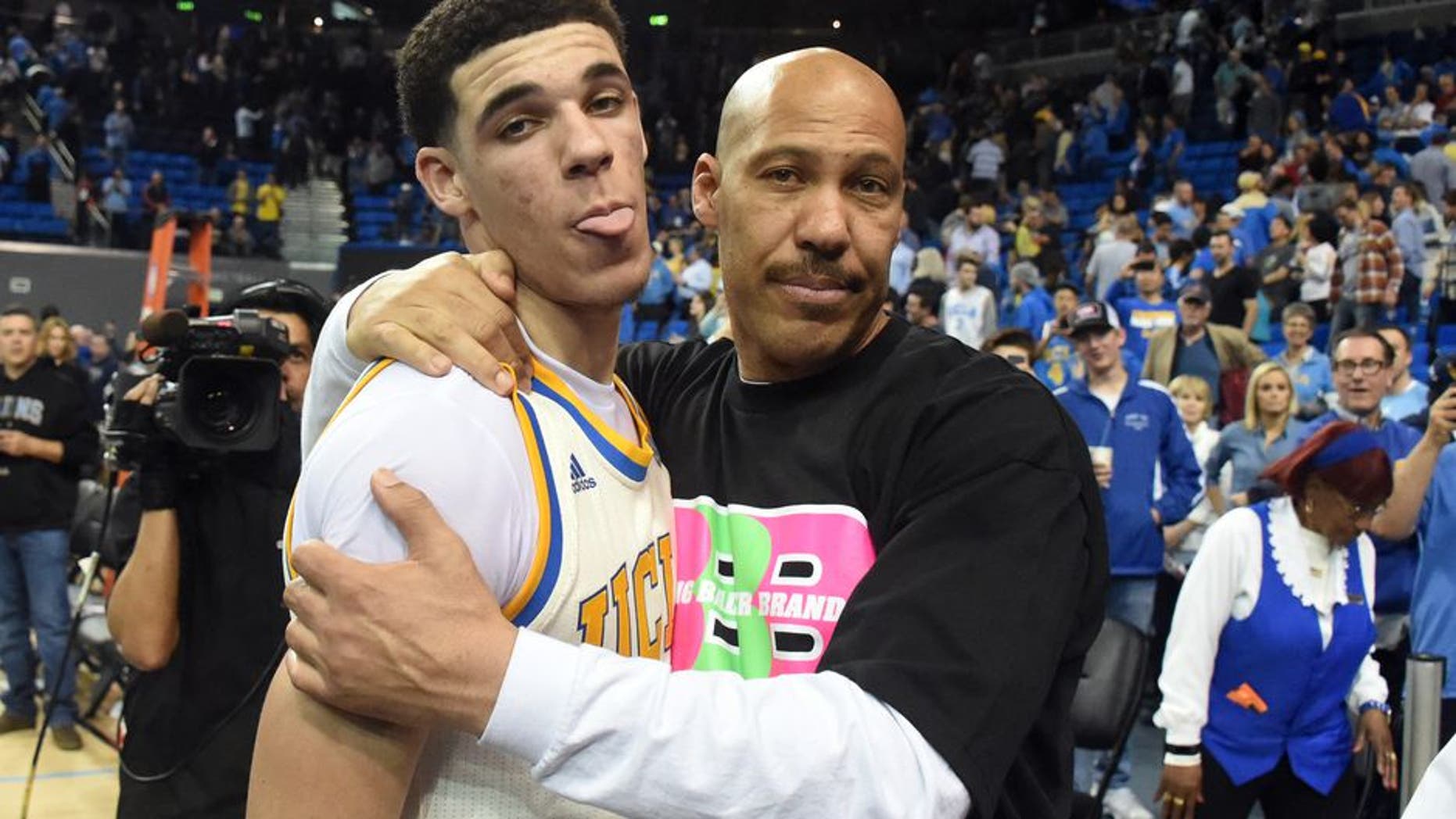 Mar 4, 2017; Los Angeles, CA, USA; Lavar Ball embraces his son UCLA Bruins guard Lonzo Ball (2) after the game against the Washington State Cougars at Pauley Pavilion. Mandatory Credit: Richard Mackson-USA TODAY Sports
