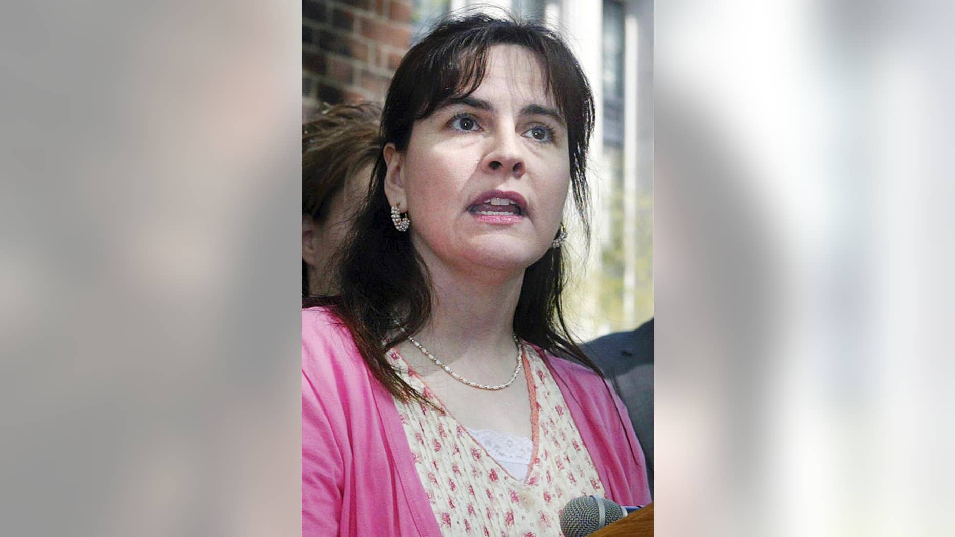 FILE - In this April 17, 2008, file photo, Lisa Miller speaks about her custody battle at a news conference following arguments during her court case in Richmond, Va. Jury selection is scheduled to begin Sept. 20, 2016, in Buffalo, N.Y., in the federal trial of Virginia businessman Philip Zodhiates, charged with helping Miller and her daughter Isabella escape in 2009 first to Canada and then to Nicaragua amid the custody battle. Miller and Janet Jenkins of Fair Haven, Vt., dissolved their civil union and Miller left when it seemed likely Jenkins would gain custody of the child born during their time together. (AP Photo/Lisa Billings, File)