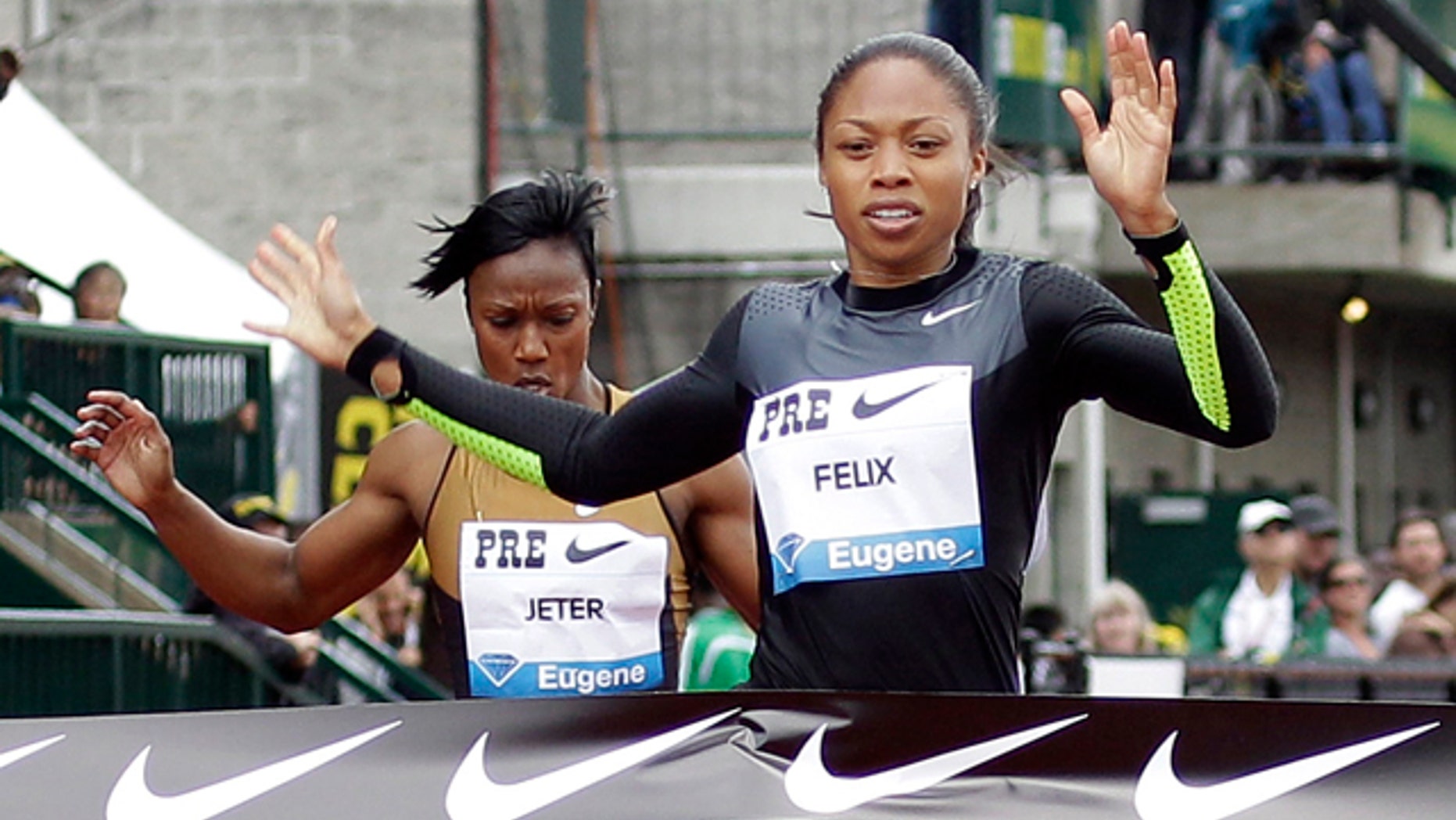 Allyson Felix will focus on the 100 and 200 meter races to maximize her chance of taking home the gold. (AP Photo)