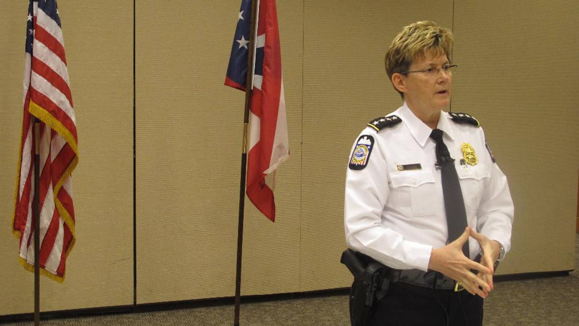 Columbus Police Chief Kim Jacobs discusses a shooting that left a SWAT officer in critical condition as officers attempted to arrest a suspect on an arson charge, on Sunday, April 10, 2016, in Columbus, Ohio. Police said the officer was in a SWAT vehicle approaching the suspect’s apartment early Saturday morning when shots were fired, hitting the officer. (AP Photo/Andrew Welsh-Huggins)