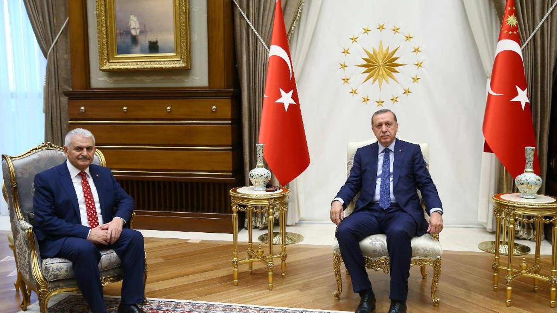 Turkey's President Recep Tayyip Erdogan, right, and Binali Yildirim, the ruling party's new chairman, pose for a photograph.