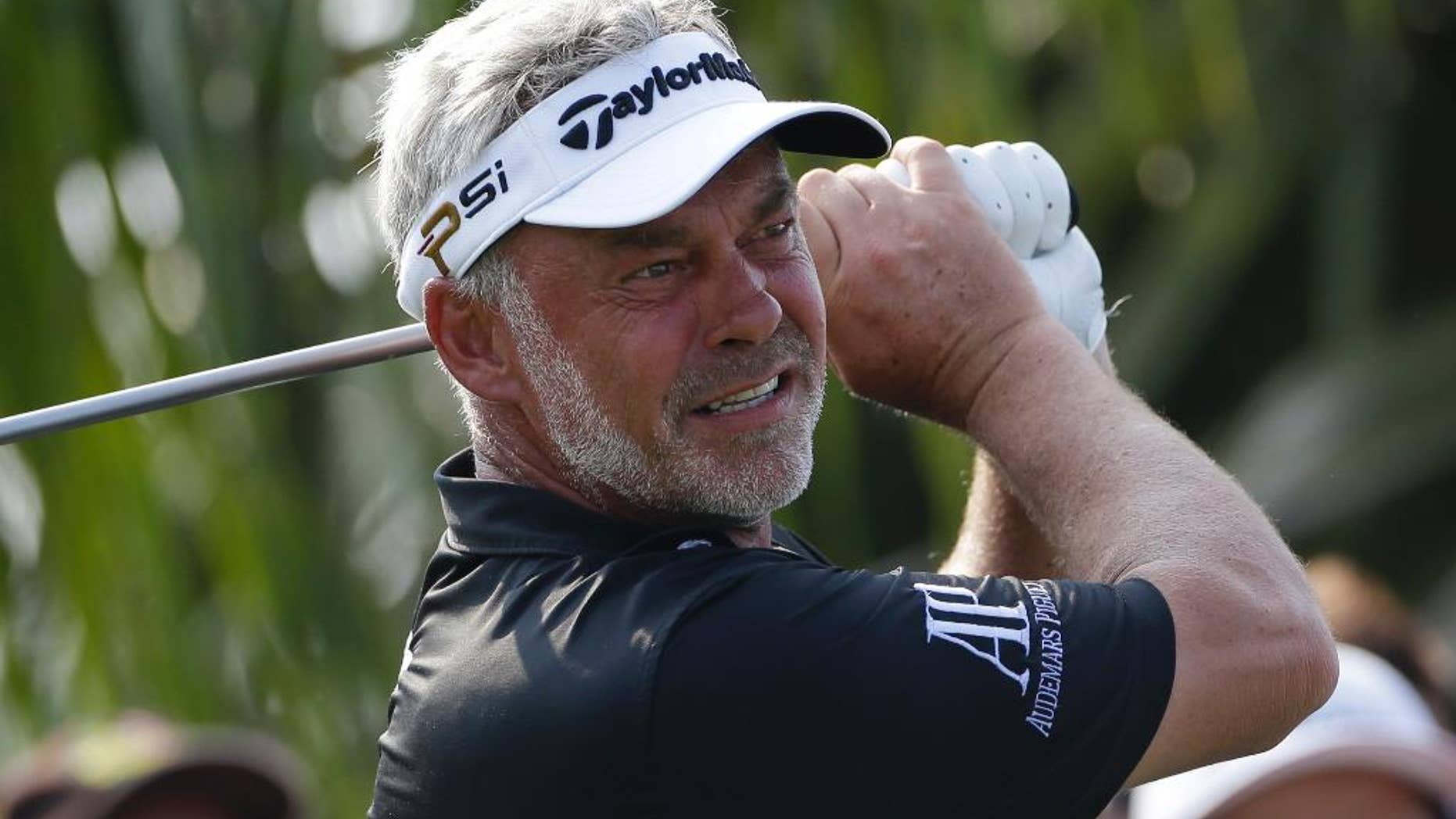 In this Sunday Dec. 13, 2015 photo Darren Clarke of Ireland hits off the 18th tee during the final round of the Thailand Golf Championship at the Amata Spring Country Club, Chonburi, Thailand. Clarke will led the Europe team against Asia in the EurAsia Cup teams event in Malaysia in January 2016. (AP Photo/Mark Baker)