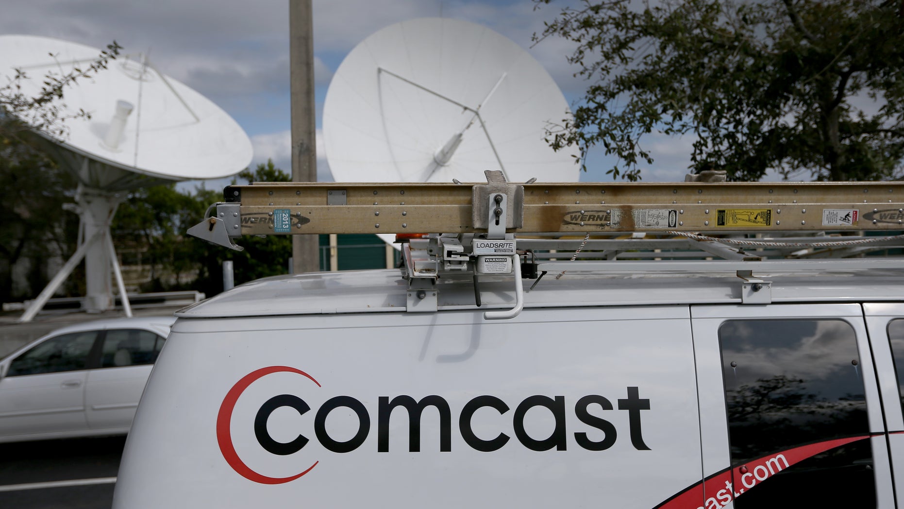 POMPANO BEACH, FL - FEBRUARY 13: A Comcast truck is seen parked at one of their centers on February 13, 2014 in Pompano Beach, Florida. Today, Comcast announced a $45-billion offer for Time Warner Cable. (Photo by Joe Raedle/Getty Images)