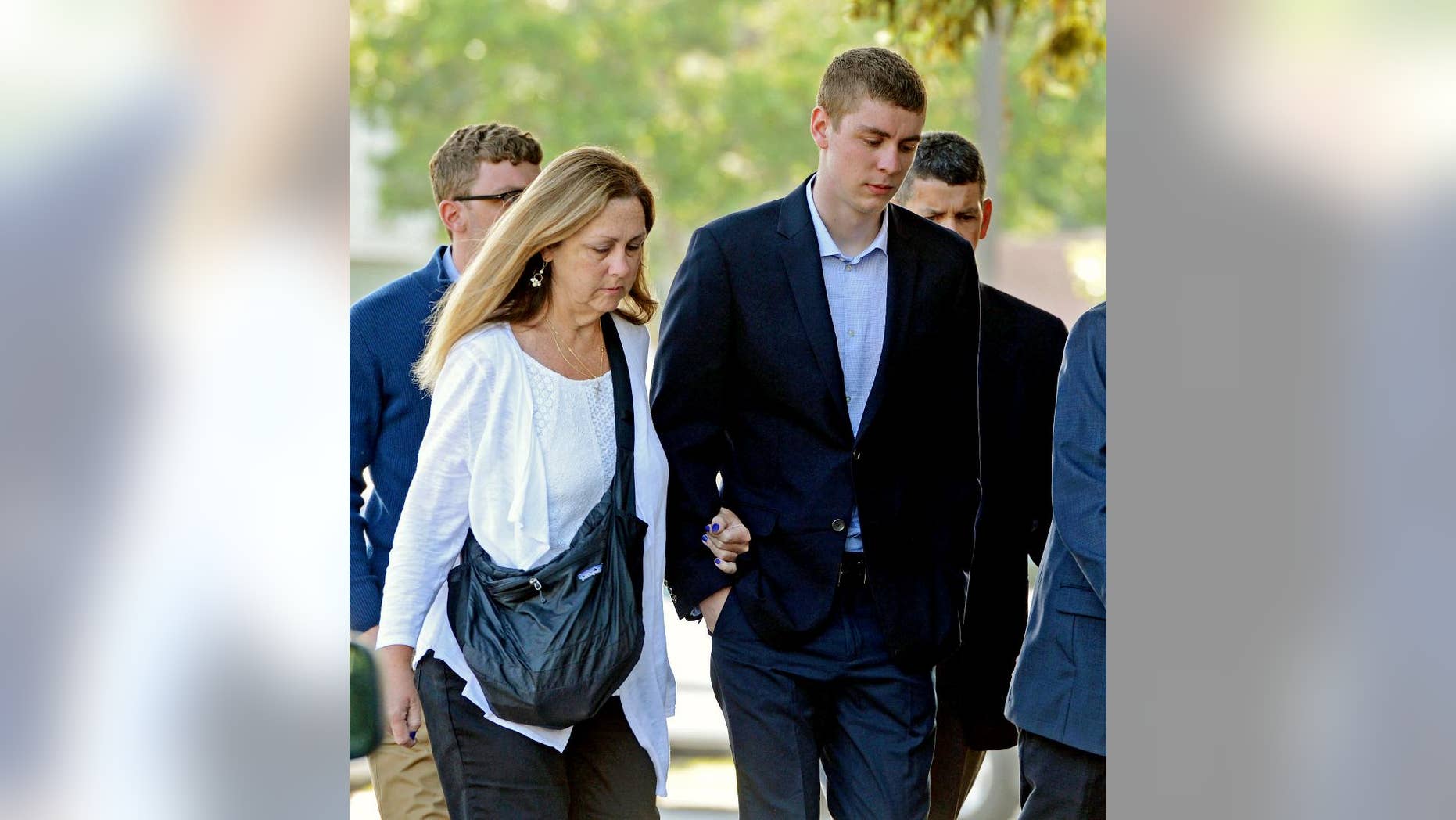June 2, 2016: Brock Turner, right, makes his way into the Santa Clara Superior Courthouse in Palo Alto, Calif.