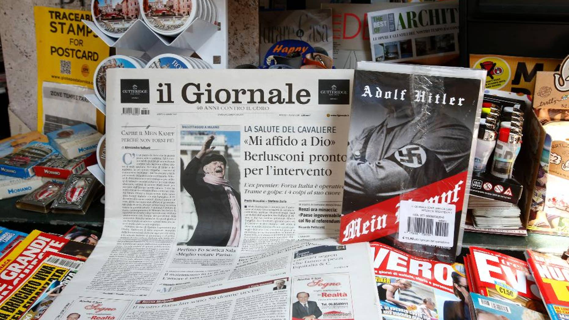 Il Giornale newspaper is seen on sale in a newsstand with Hitler's "Mein Kampf", in Rome Saturday, June 11, 2016. The conservative Milan daily Il Giornale
has published Hitler’s political manifesto ‘’Mein Kampf,’’ angering Italy’s premier and the tiny Jewish community. (AP Photo/Fabio Frustaci)