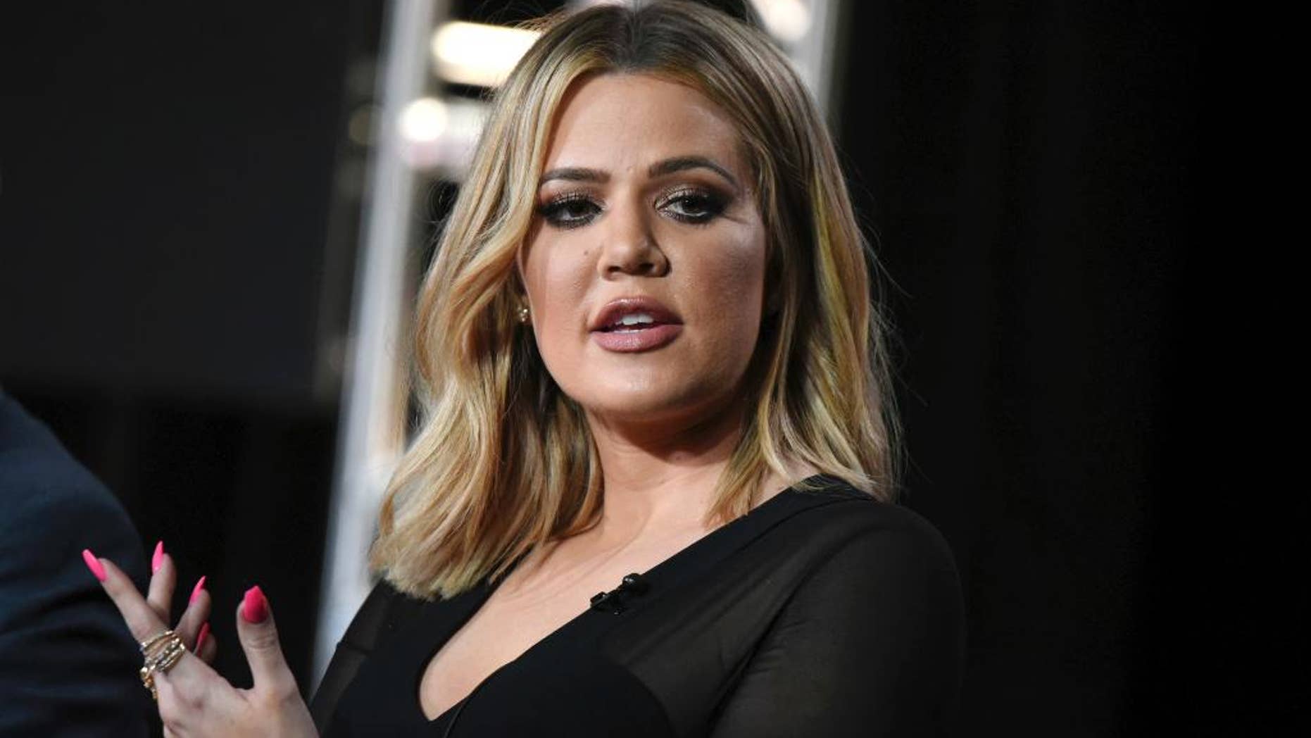 FILE - In this Jan. 6, 2016, file photo, Khloe Kardashian participates in the panel for "Kocktails with Khloe" at the FYI 2016 Winter TCA in Pasadena, Calif. Kardashian is calling her sister's robbery on Oct. 3, in Paris "a wake up call for everybody" but is pushing back against criticism that Kim Kardashian West had been too public in displaying her wealth. (Photo by Richard Shotwell/Invision/AP, File)