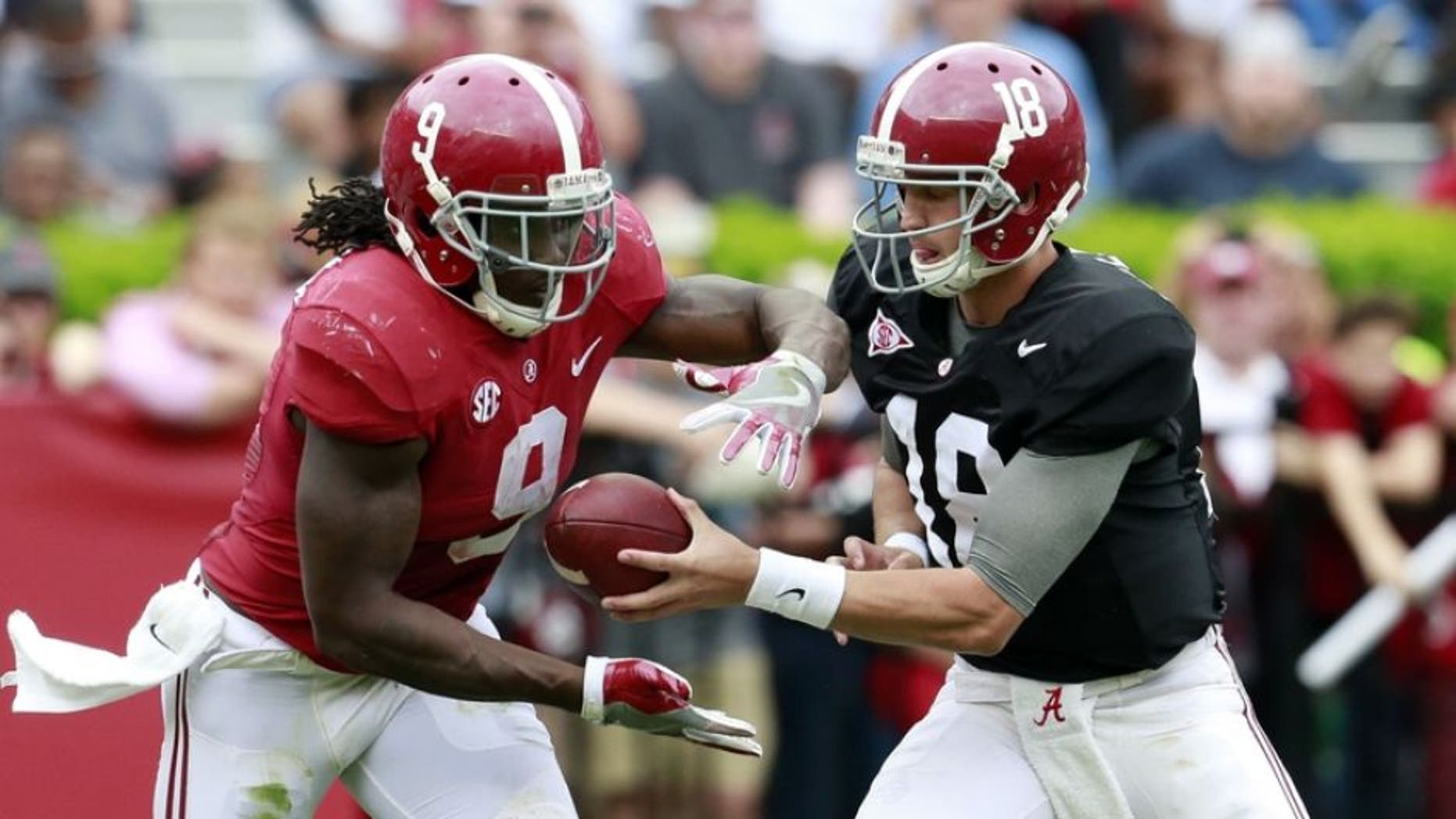 Apr 16, 2016; Tuscaloosa, AL, USA; Alabama Crimson Tide quarterback Cooper Bateman (18) hands the ball off too Alabama Crimson Tide running back Bo Scarbrough (9) at Bryant-Denny Stadium. Mandatory Credit: Marvin Gentry-USA TODAY Sports