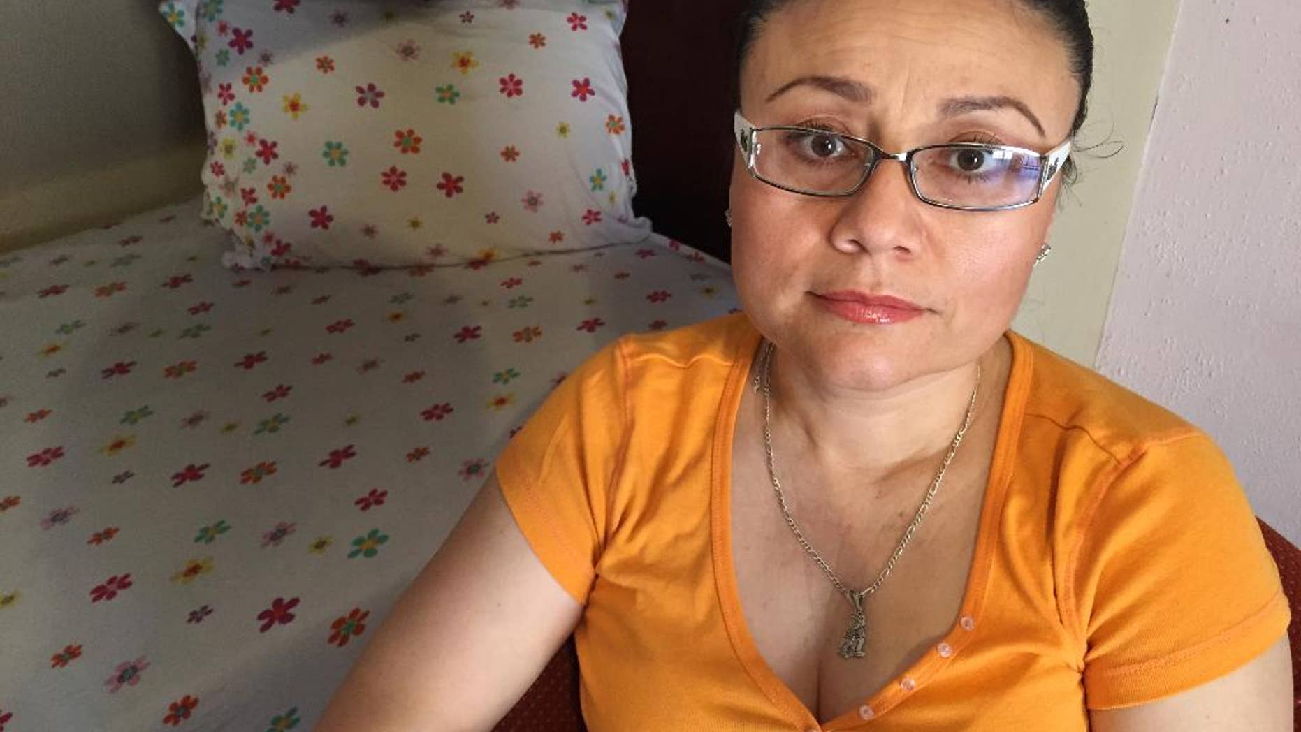 In this Thursday, July 30, 2015 photo, Rosa Robles Loreto sits in her small room at Southside Presbyterian Church in Tucson, Ariz., where she has taken sanctuary from deportation for a year. Robles Loreto, 42, says she is not leaving the church until the government assures her she will not be deported. (AP Photo/Astrid Galvan,File)