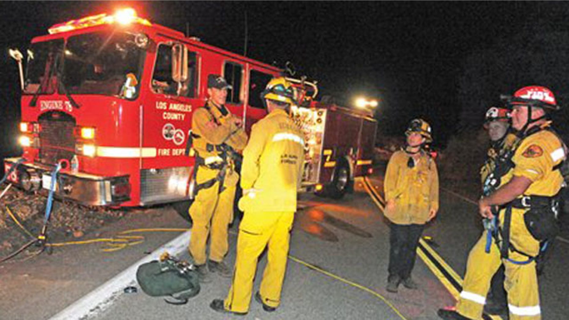 Sept. 29: Los Angeles County firefighters are stationed on Lake Hughes Road, where two vehicles were found off the side and approximately 200 feet in the canyon below in the Angeles National Forest.