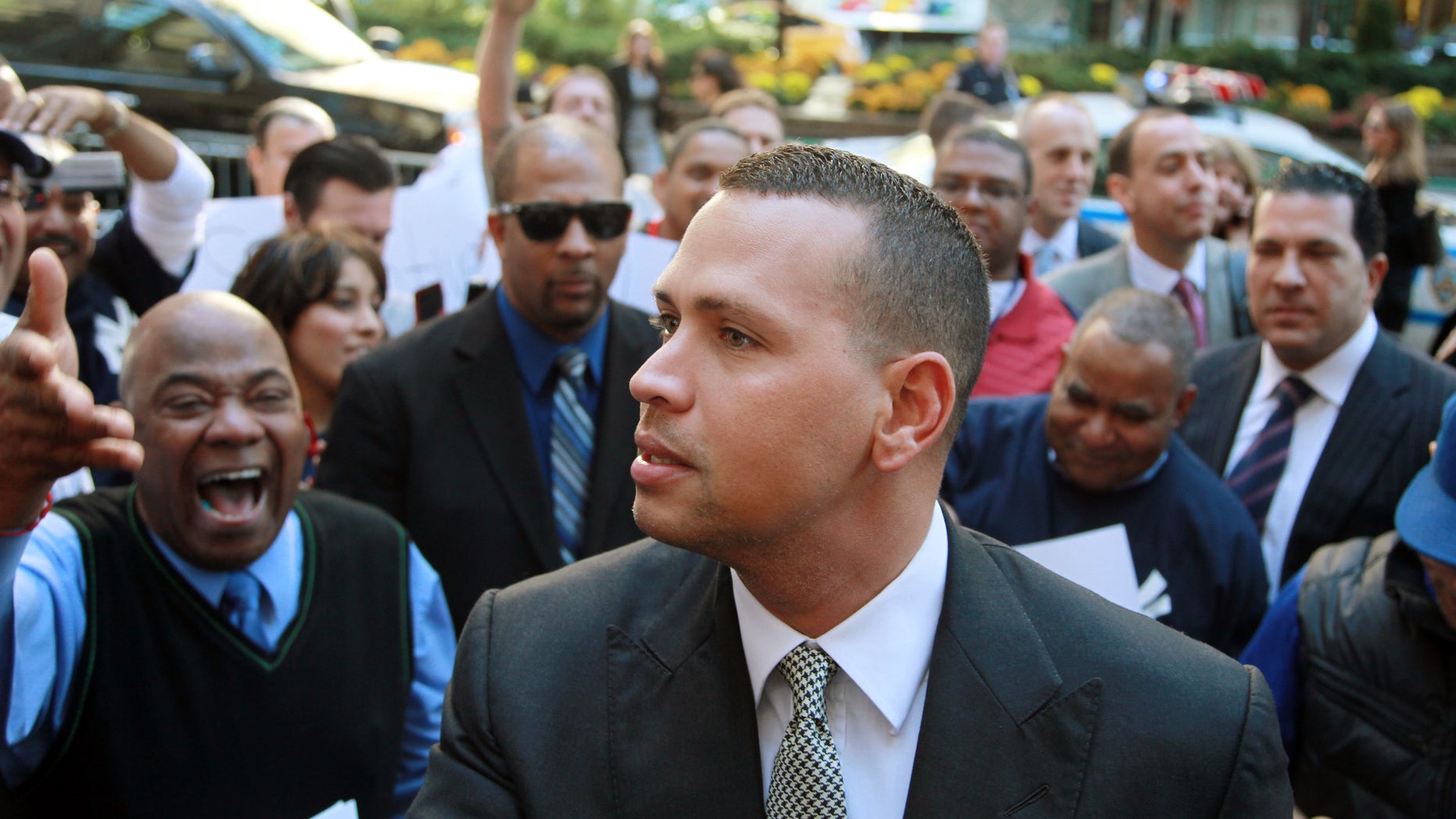 FILE - In this Oct. 1, 2013, file photo, New York Yankees' Alex Rodriguez arrives at the offices of Major League Baseball in New York. Hearings on the grievance to overturn Rodriguez's 211-game suspension recessed on Friday, Oct. 18, 2013, for a month after MBL completed its direct case. (AP Photo/David Karp, File)