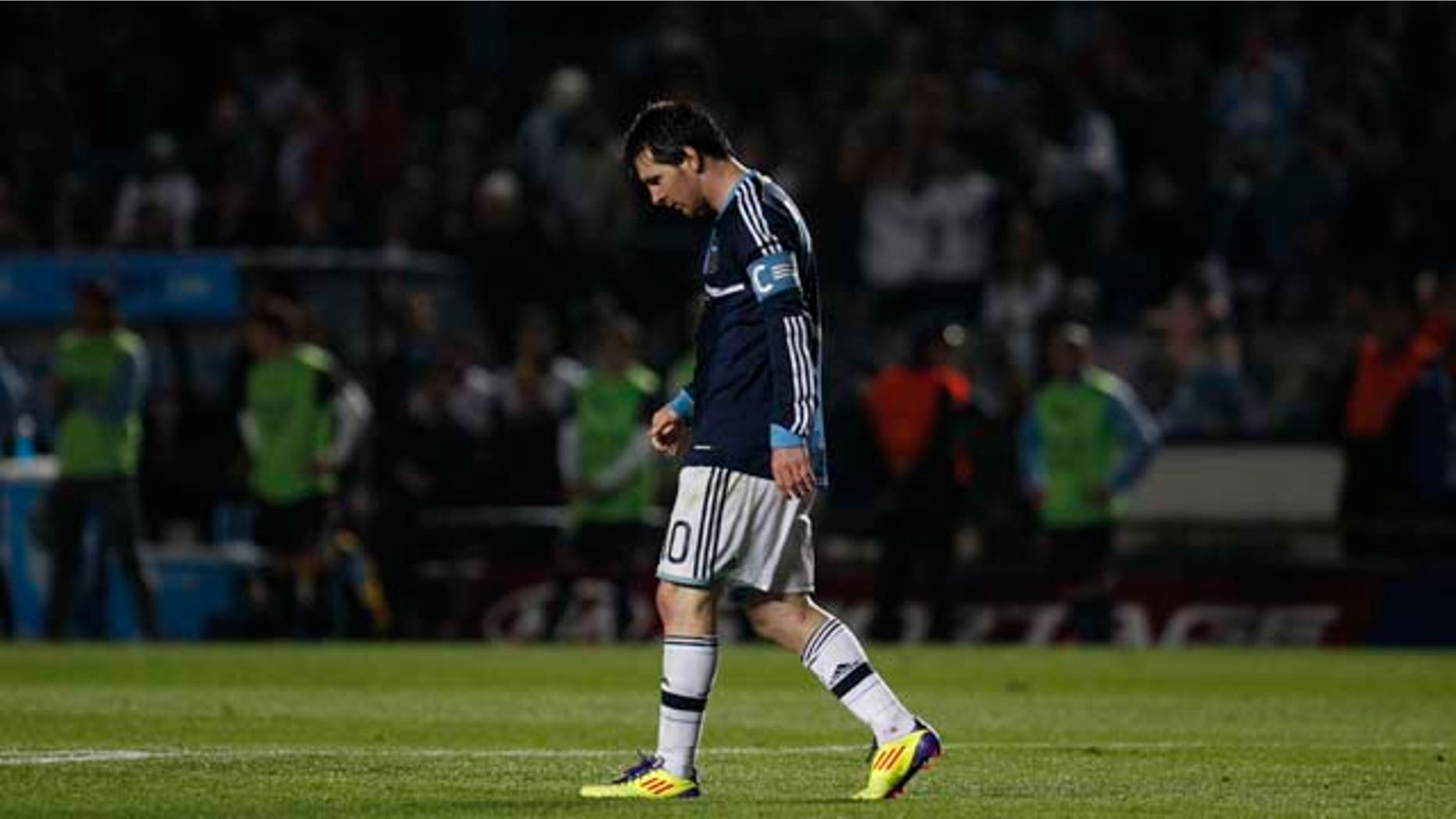 Argentina's Lionel Messi walks on the field during a Copa America quarterfinal soccer match against Uruguay in Santa Fe, Argentina, Saturday, July 16, 2011. Uruguay advanced to the Copa America semifinals with a 5-4 victory over Argentina on penalties after a 1-1 draw. (AP Photo/Dolores Ochoa)