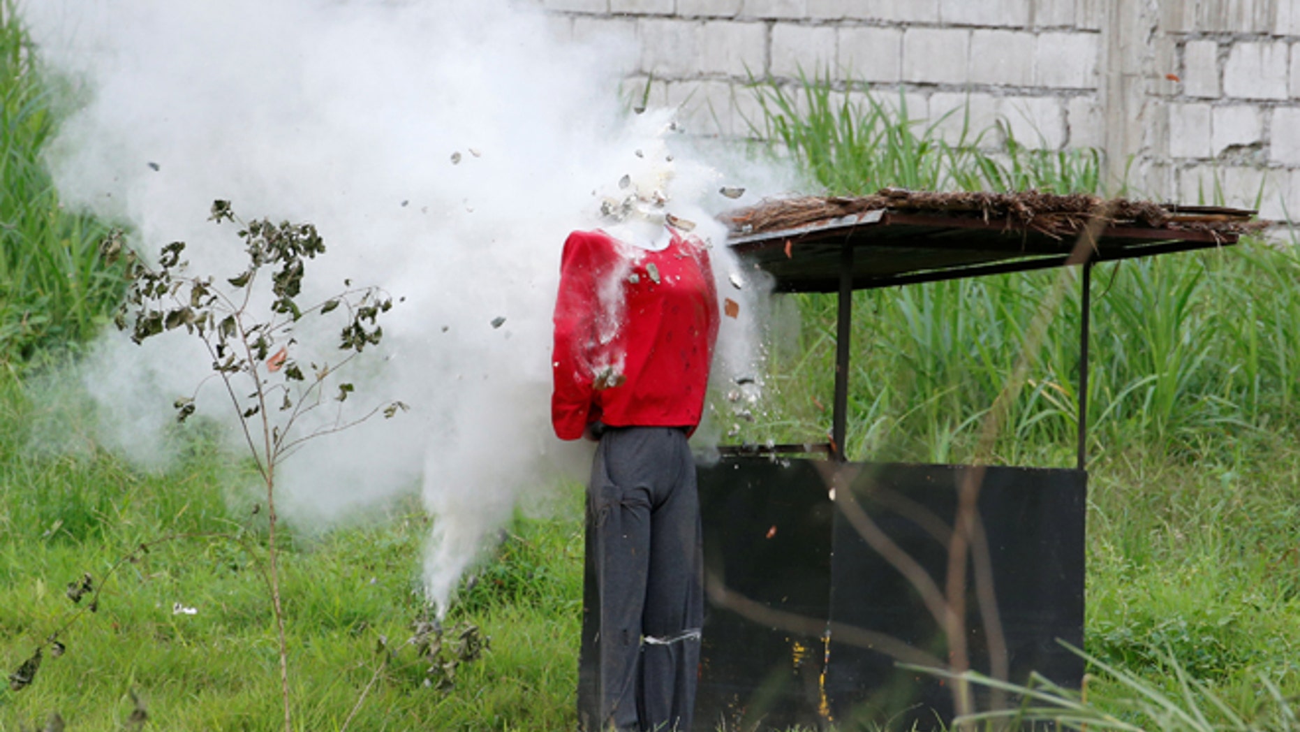Sept. 15: A mannequin's head explodes during an assault drill by soldiers as they perform before Philippine President Rodrigo Duterte (not pictured) at the military's Scout Ranger Camp Tecson in San Miguel, Bulacan in northern Philippines