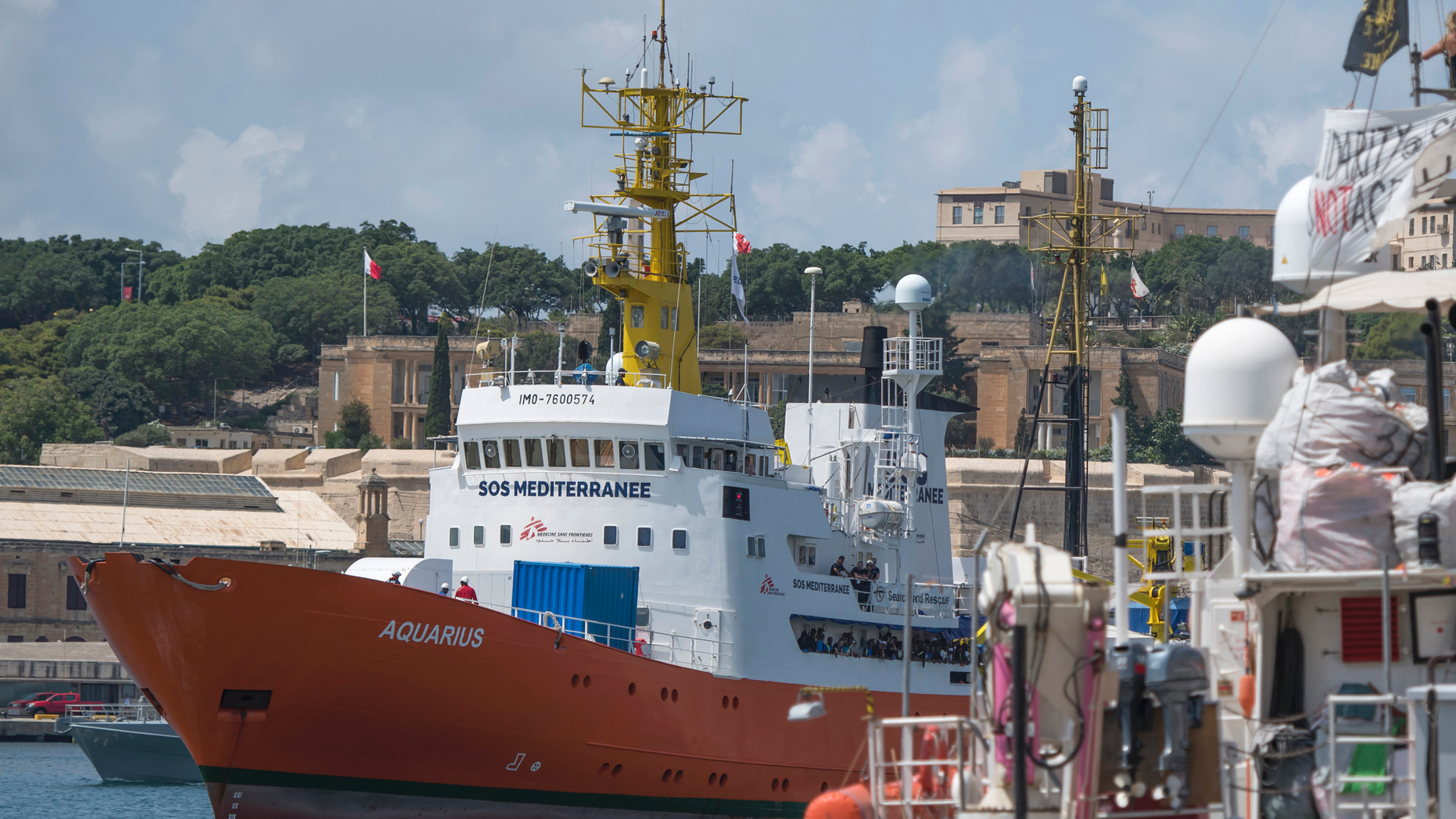 FILE - In a Aug. 15, 2018 file photo, the Aquarius rescue ship enters the harbor of Senglea, Malta. Spain’s maritime rescue service said Sunday, Sept. 23, 2018 that it rescued more than 400 people from 15 small boats, most of them off the country’s southern coast, while humanitarian groups lamented that the sole private rescue boat operating near the deadly central Mediterranean human trafficking route risked being put out of action by Italy’s anti-migrant leaders. (AP Photo/Rene Rossignaud, File)