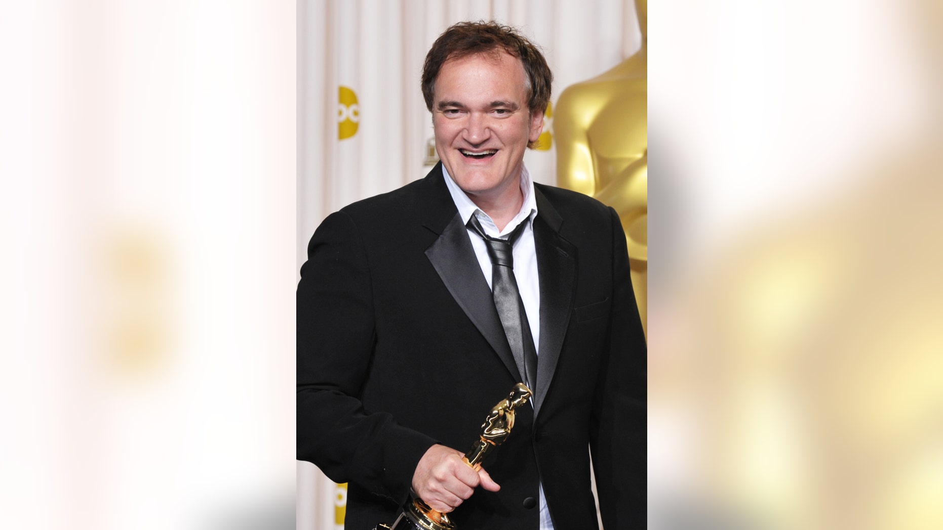 Quentin Tarantino poses with his award for best original screenplay for "Django Unchained" during the Oscars at the Dolby Theatre on Sunday Feb. 24, 2013, in Los Angeles. (Photo by John Shearer/Invision/AP)