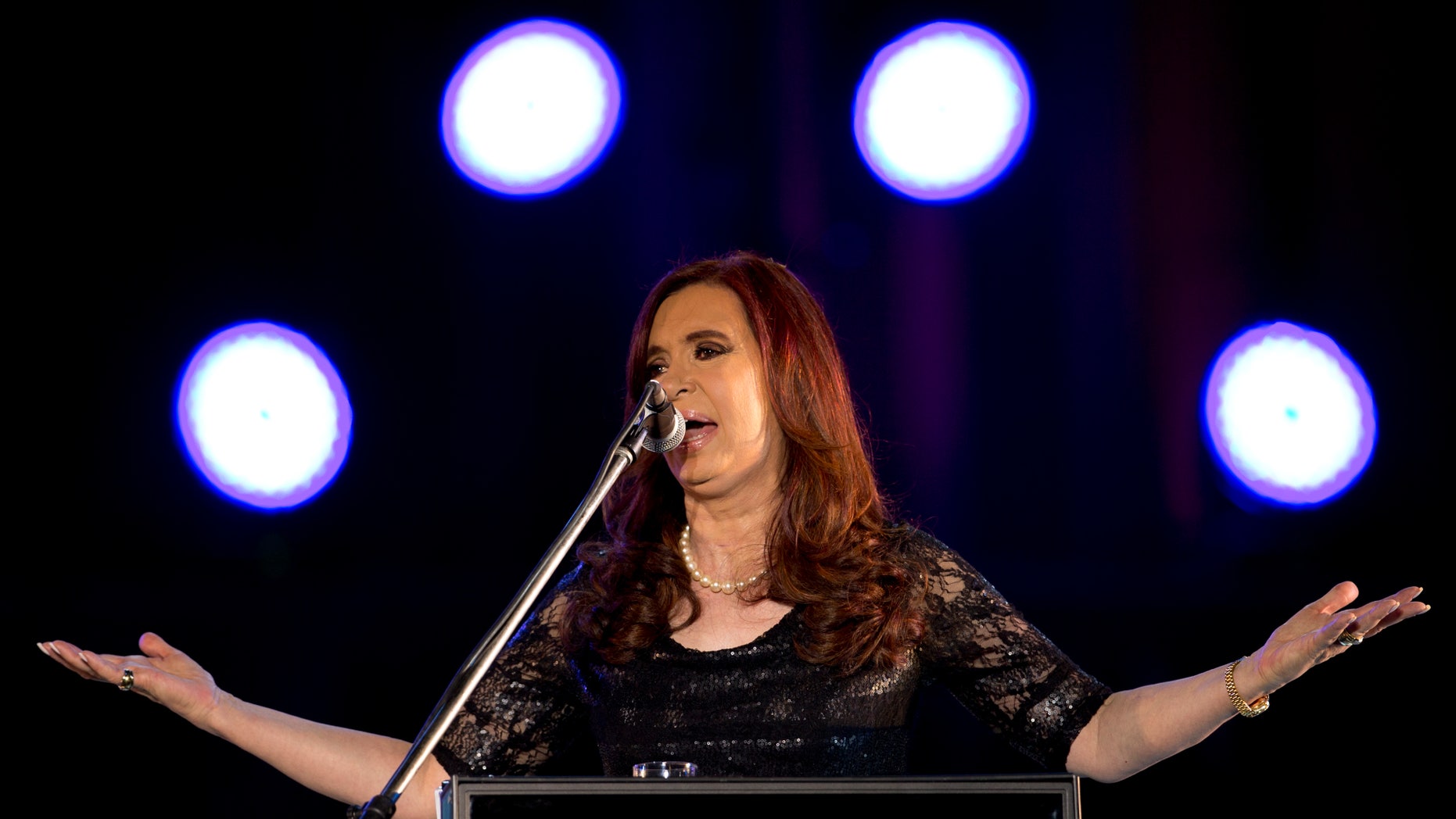 FILE - In this Dec. 9, 2012, file photo, Argentina's President Cristina Fernandez delivers a speech during a rally marking the 29th anniversary of the return to democracy in Argentina, on the eve of the Human Rights day, in Buenos Aires, Argentina. It's been a decade since Argentina tarnished its reputation worldwide and became an economic misfit by engaging in the biggest sovereign debt default in history, yet it is still haunted by the old bonds. Although Argentina's government restructured nearly all of the debt defaulted in the 2001 economic crisis, Fernandez finds herself in a bitter U.S. court fight with holdout creditors that has raised the threat of severe financial repercussions. (AP Photo/Victor R. Caivano, file)