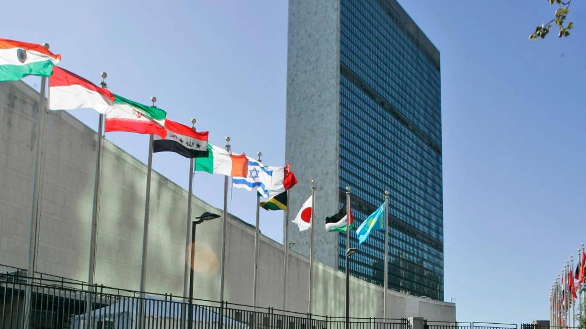 FFILE - In this Sept. 18, 2007 file photo, the flags of member nations fly outside of the United Nations headquarters. In a move likely to upset Israel's government, the Palestinians and the Vatican are seeking to raise their flags at the U.N., just in time for Pope Francis' visit in September 2015. (AP Photo/Mary Altaffer, File)