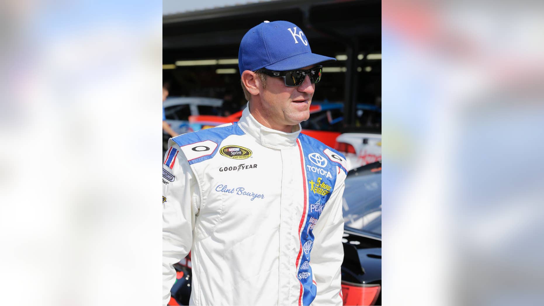 Clint Bowyer walks through the garage before a NASCAR Sprint Cup practice session at Darlington Raceway in Darlington, S.C., Friday, Sept. 4, 2015. (AP Photo/Terry Renna)