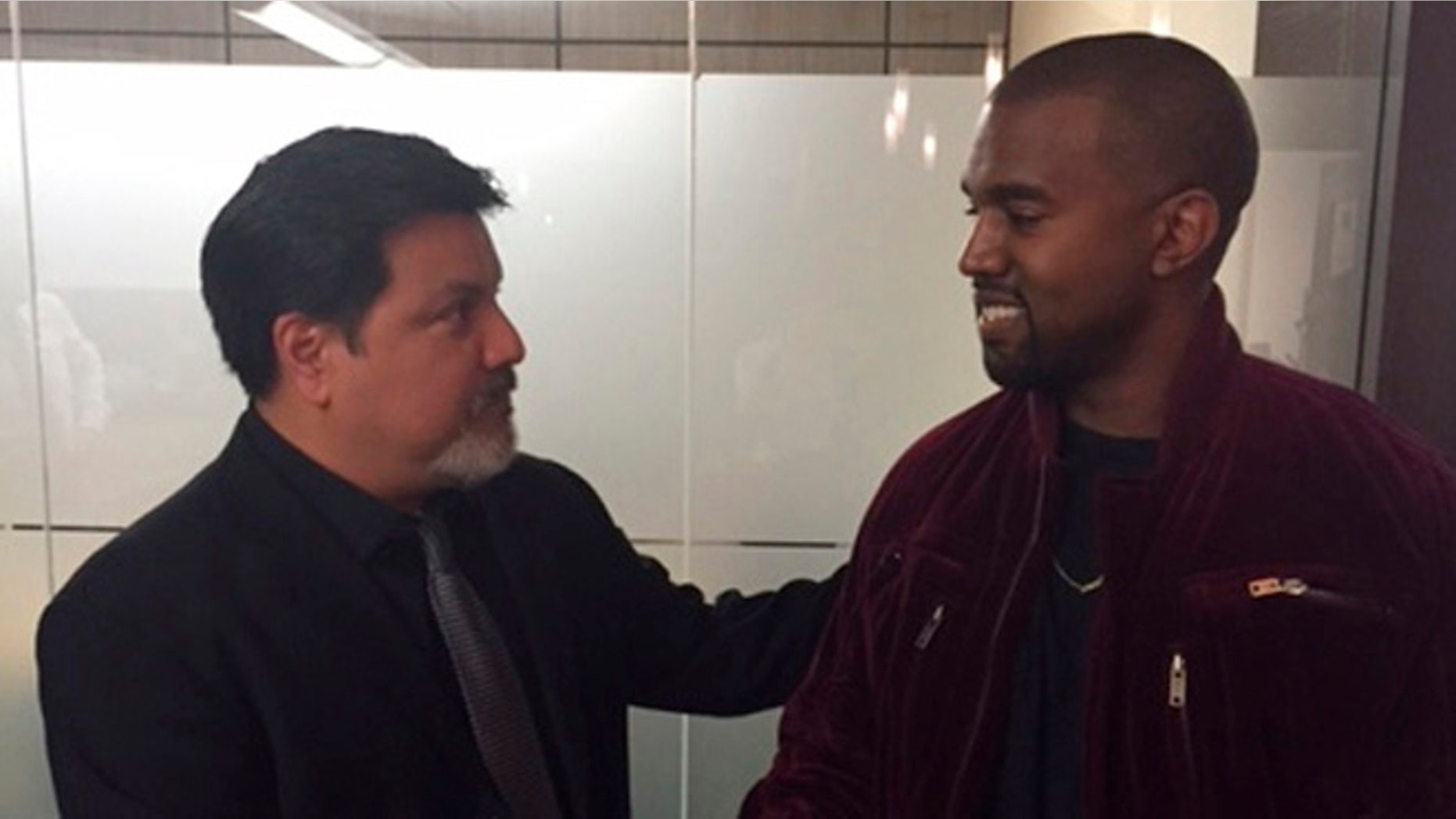 This March 2015 photo provided by courtesy of Allred, Maroko and Goldberg shows videographer Daniel Ramos, left, and Kanye West, shaking hands after West apologized to Ramos as part of a settlement, in Los Angeles. This assault case was set for trial next week on April 14, 2015, but Ramos' lawyer, Gloria Allred, filed for a dismissal on April 7, after a settlement was agreed to by both parties. One important aspect of the settlement was an apology by West to Ramos. (AP Photo/Courtesy Allred, Maroko and Goldberg)