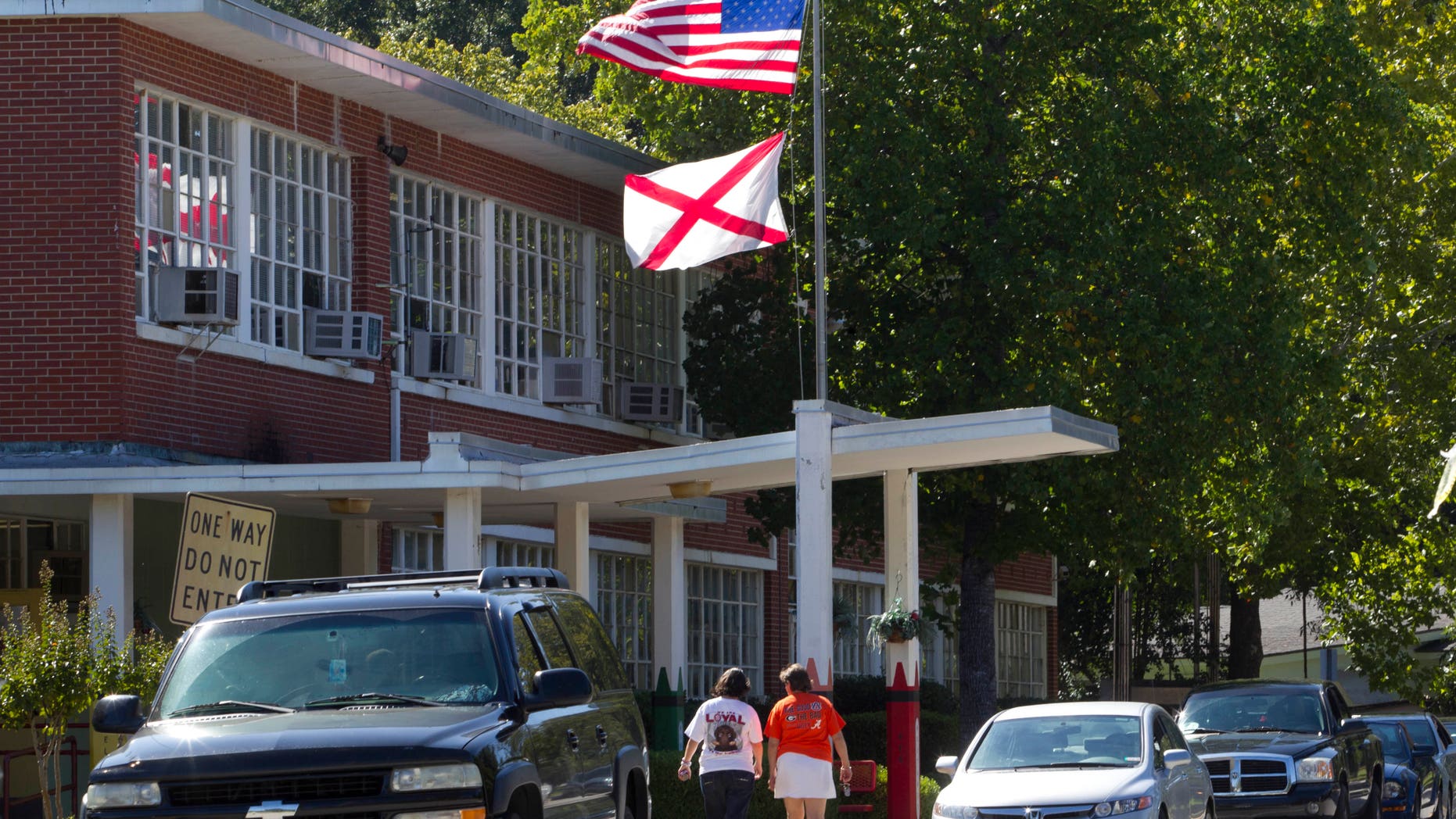 Sep. 30: Mothers arrive to pick up their children from Flowers School in Montgomery, Ala. (AP Photo/Dave Martin)