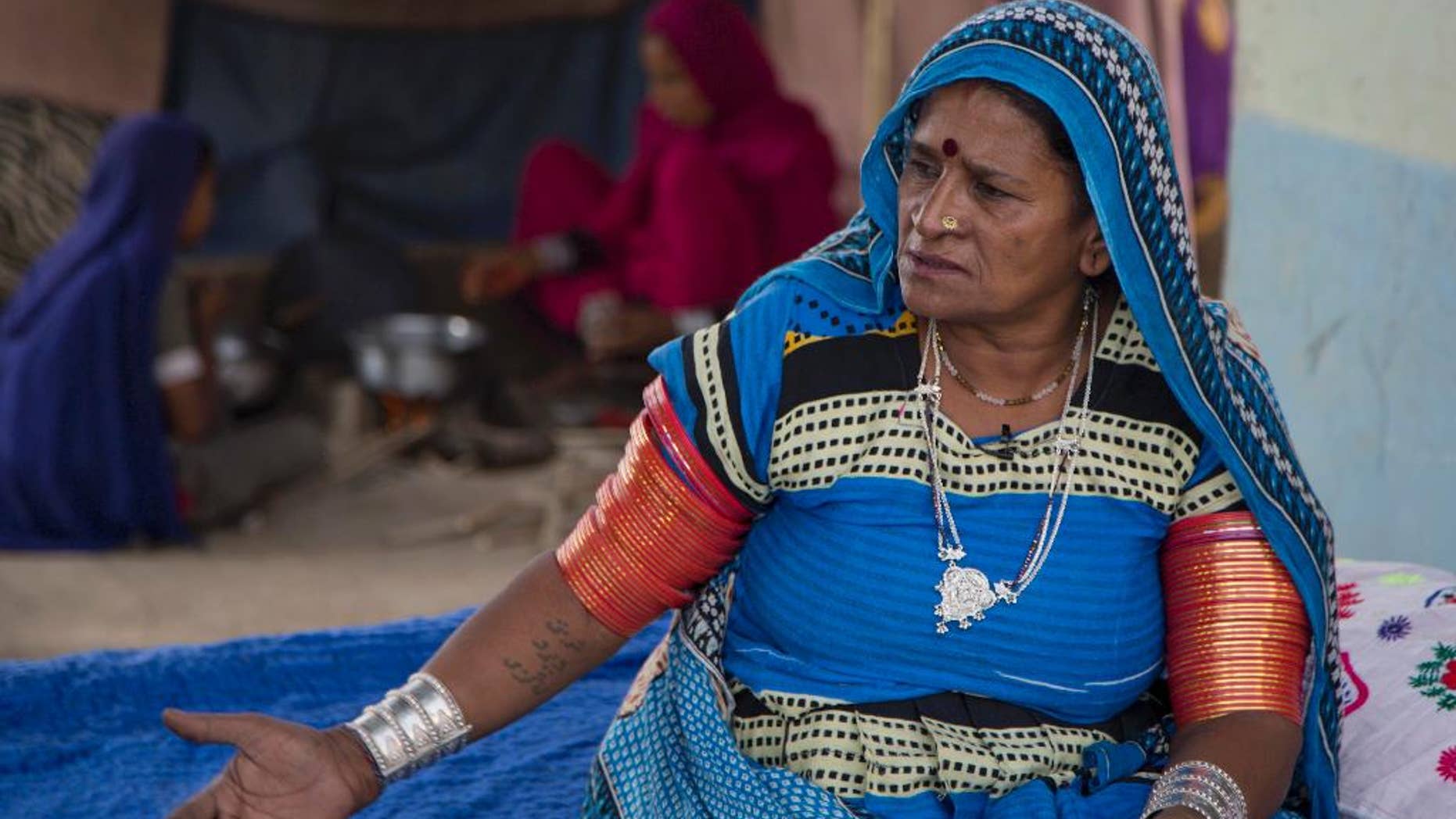 In this photo taken on Saturday , Dec. 3, 2016. Pakistani activist Veero Kohli talks to The Associated Press in Hyderabad, Pakistan. Kolhi, who also was a slave, fled bondage in 1999 walking for three days to safety, searching out the Human Rights Commission of Pakistan to help her before returning to the landowner to recover her children and free another eight of families. Since getting her freedom, Kolhi has devoted herself to challenging Pakistan's powerful landowners freeing thousands of families from bonded labor. (AP Photo/B.K. Bangash)