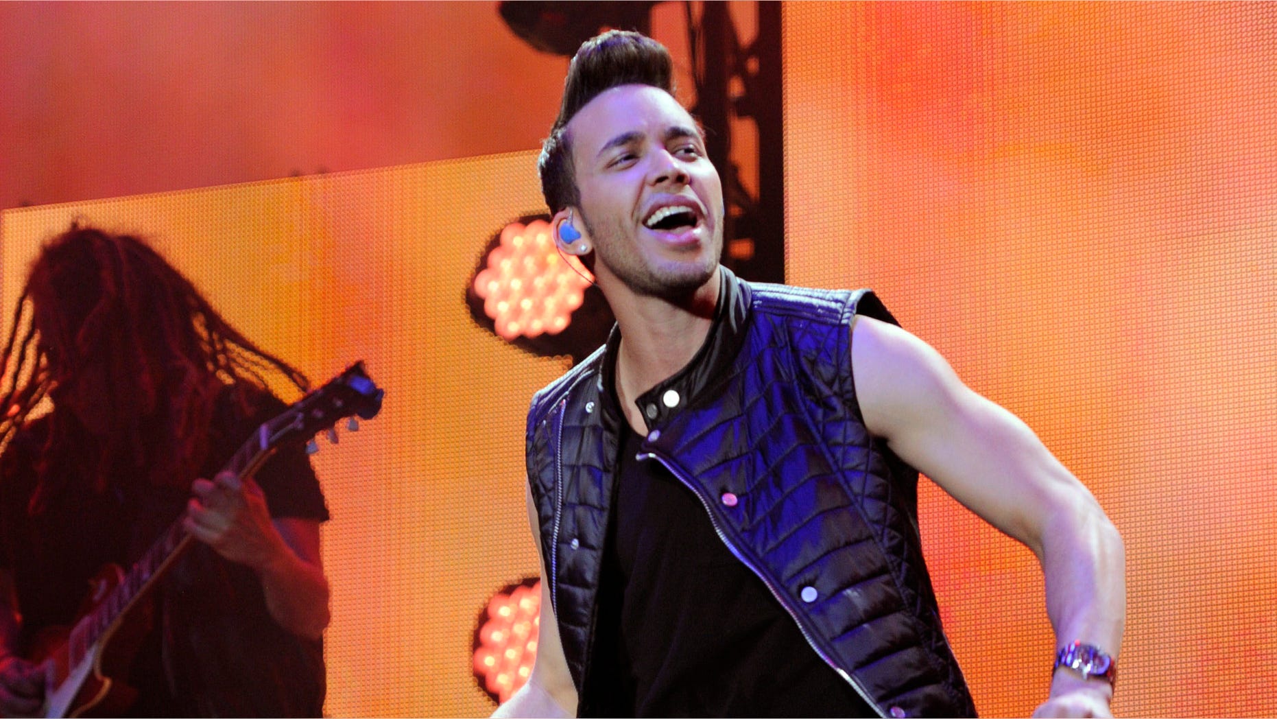 FILE - In this Nov. 22, 2014 file photo, Prince Royce performs at the iHeart Radio Fiesta Latina concert at The Forum, in Inglewood, Calif. Prince Royce has been invited to participate in the soundtrack of "Furious 7" "My Angel" (Photo by Chris Pizzello/Invision/AP File)