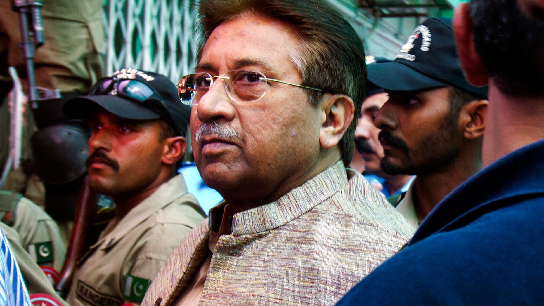 FILE - In this April 20, 2013, file photo, Pakistan's former President and military ruler Pervez Musharraf arrives at an anti-terrorism court in Islamabad, Pakistan. A defense lawyer Ilyas Saddiqi says a court granted Musharraf bail Monday, Nov. 4, 2013 in a case involving his alleged role in the death of a radical cleric killed during a raid on a hard-line mosque in Islamabad in 2007. (AP Photo/Anjum Naveed, File)