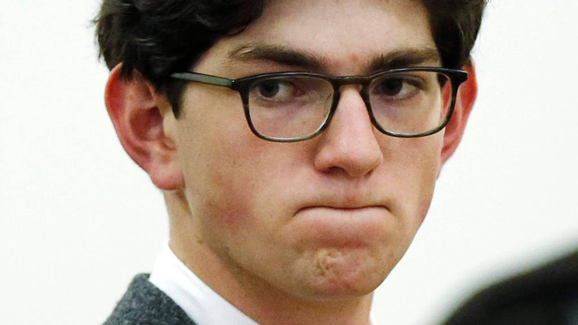 FILE - In this Oct. 29, 2015, file photo, Owen Labrie listens to prosecutors before being sentenced in Merrimack County Superior Court in Concord, N.H. Labrie was convicted of sexually assaulting a younger prep school classmate in 2014 and was sentenced to jail. A hearing is scheduled to start Tuesday, Feb. 21, 2107, to determine if he school should get a new trial on charges of using a computer to lure the underage student for sex and assaulting her. (AP Photo/Jim Cole, Pool, File)