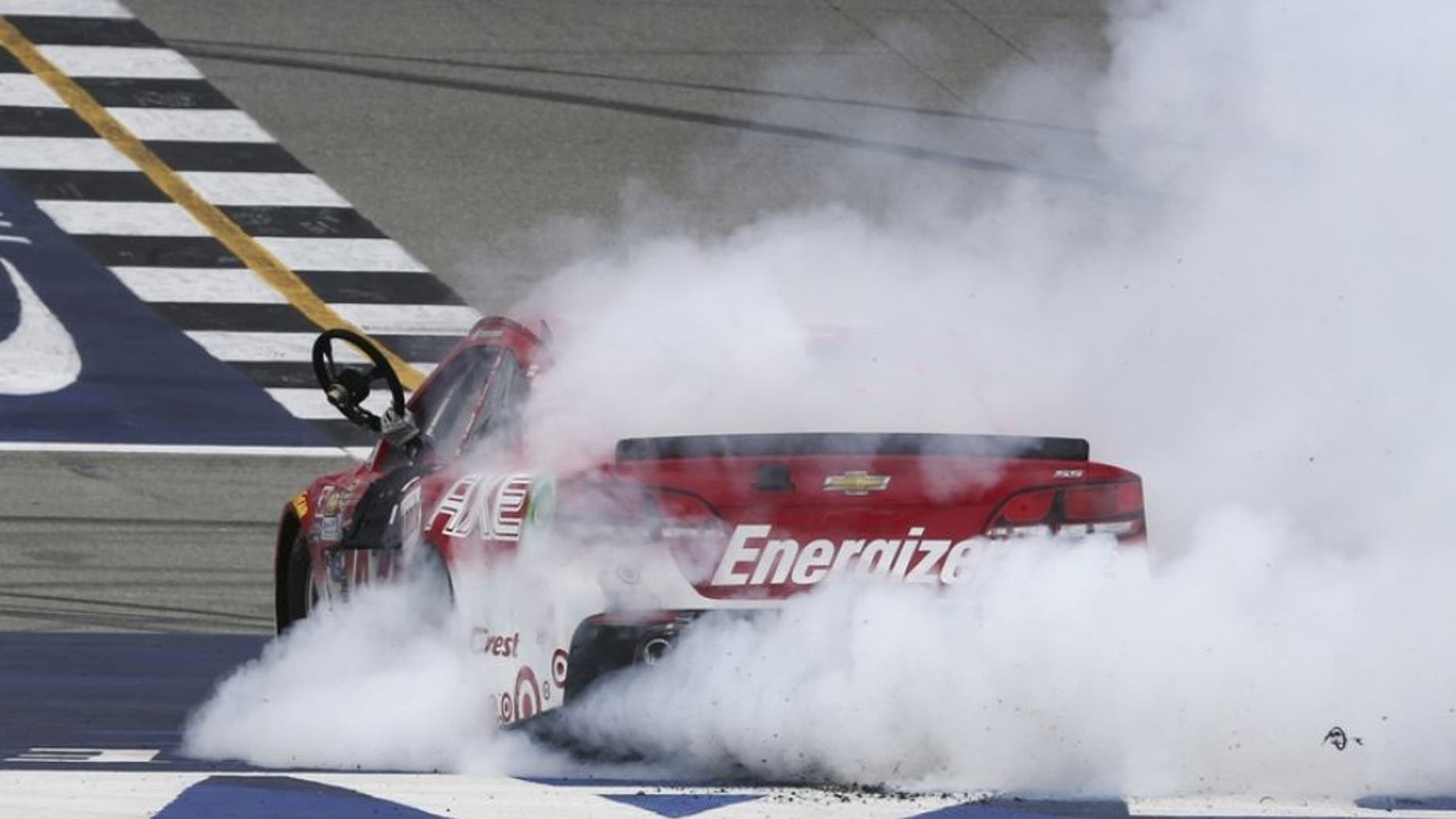 Aug 28, 2016; Brooklyn, MI, USA; Sprint Cup Series driver Kyle Larson (42) celebrates winning the Pure Michigan 400 at the Michigan International Speedway. Mandatory Credit: Aaron Doster-USA TODAY Sports