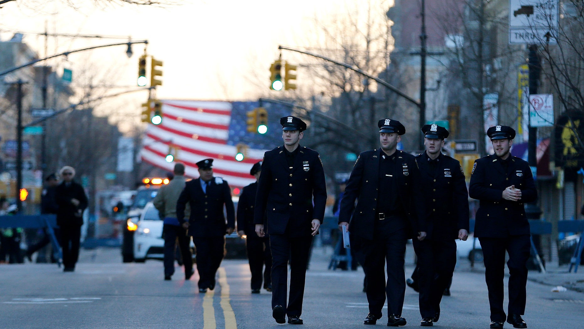 NYPD officers attend funeral services for officer Rafael Ramos on Saturday, Dec. 27, 2014, in New York.