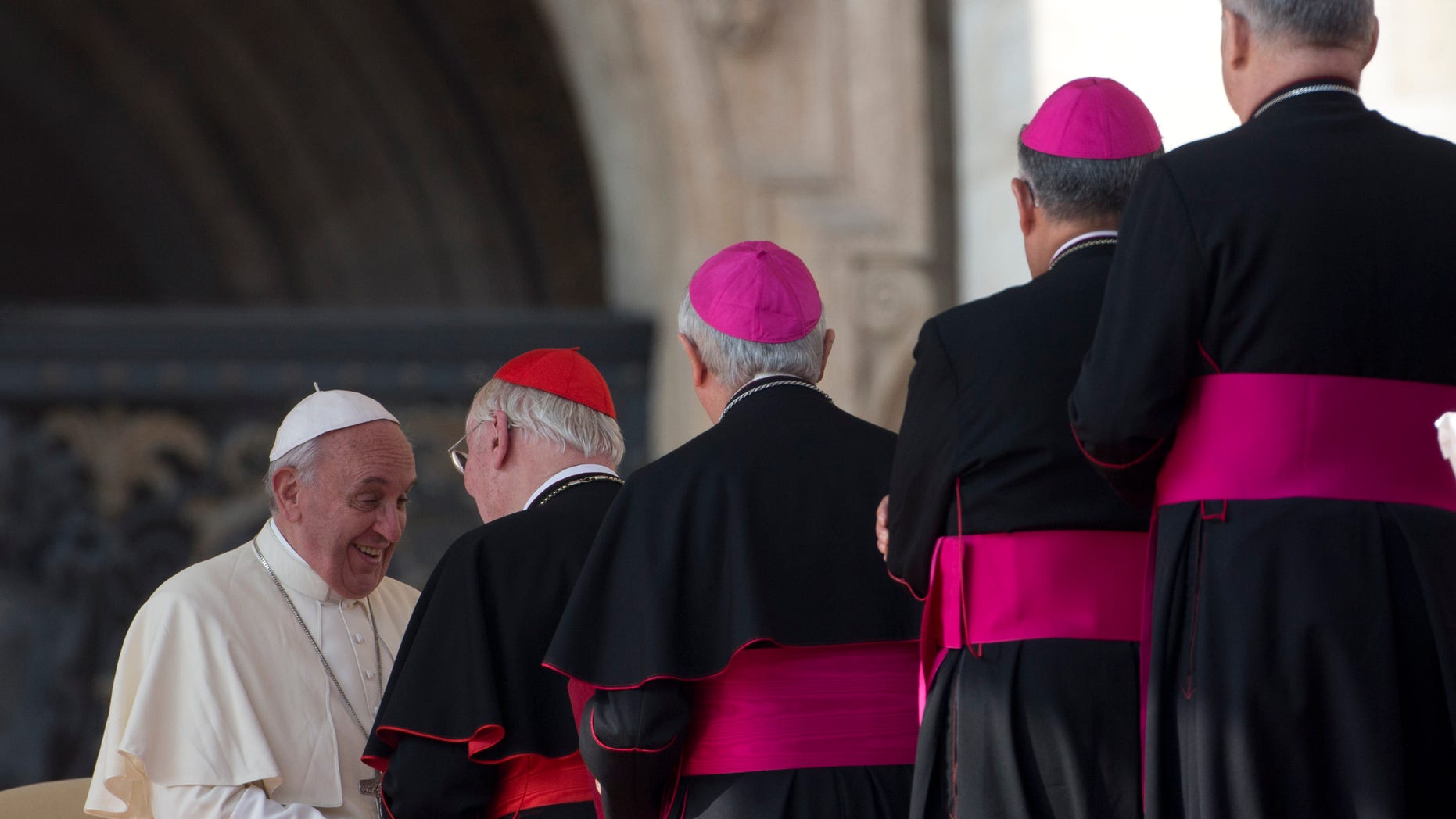 Cardinals and Bishops line up to greet Pope Francis at the end of his weekly general audience in St. Peter's Square at the Vatican, Wednesday, Oct. 30, 2013.(AP Photo/Alessandra Tarantino)