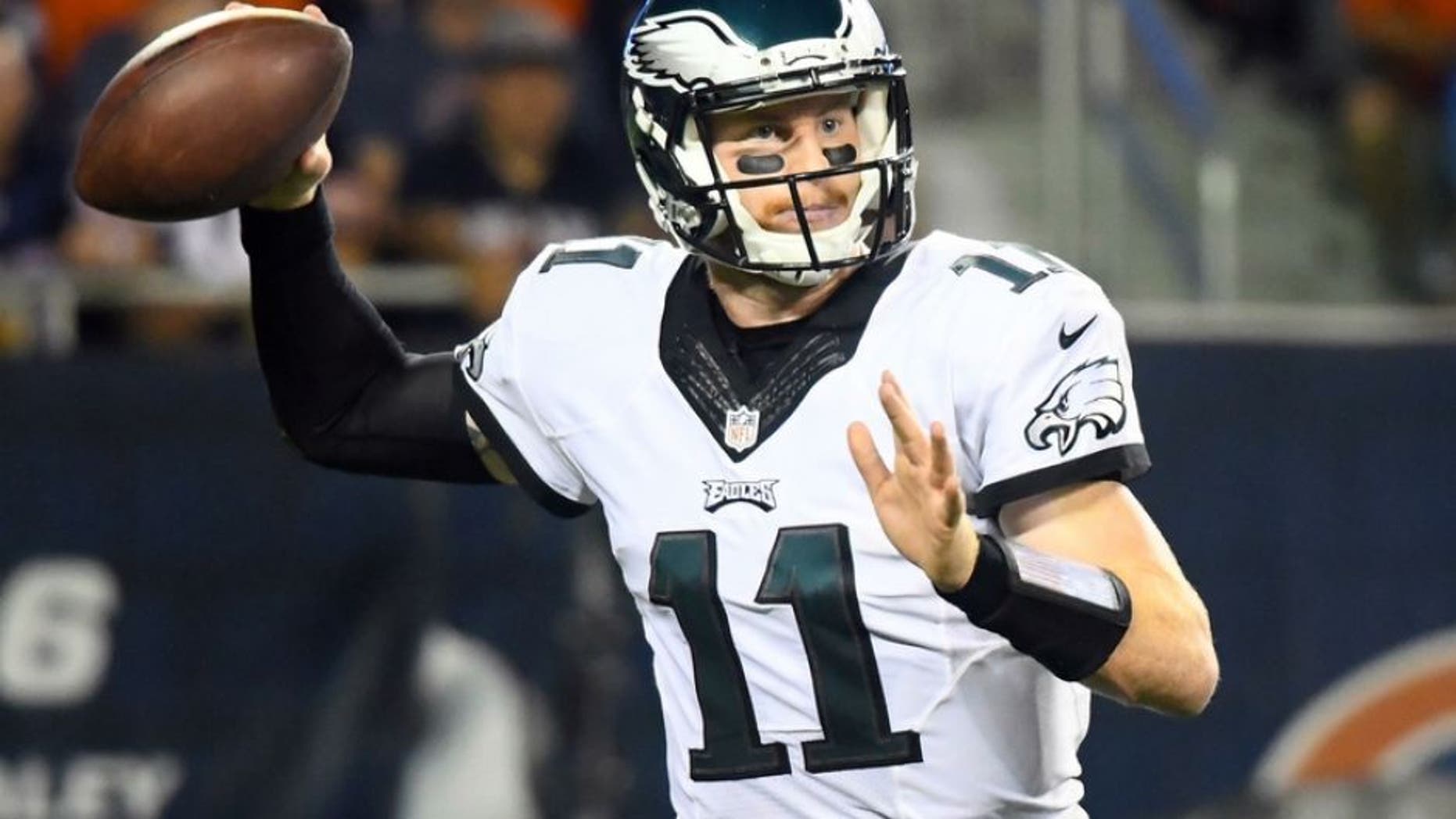 Sep 19, 2016; Chicago, IL, USA; Philadelphia Eagles quarterback Carson Wentz (11) drops back to pass against the Chicago Bears during the second quarter at Soldier Field. Mandatory Credit: Mike DiNovo-USA TODAY Sports