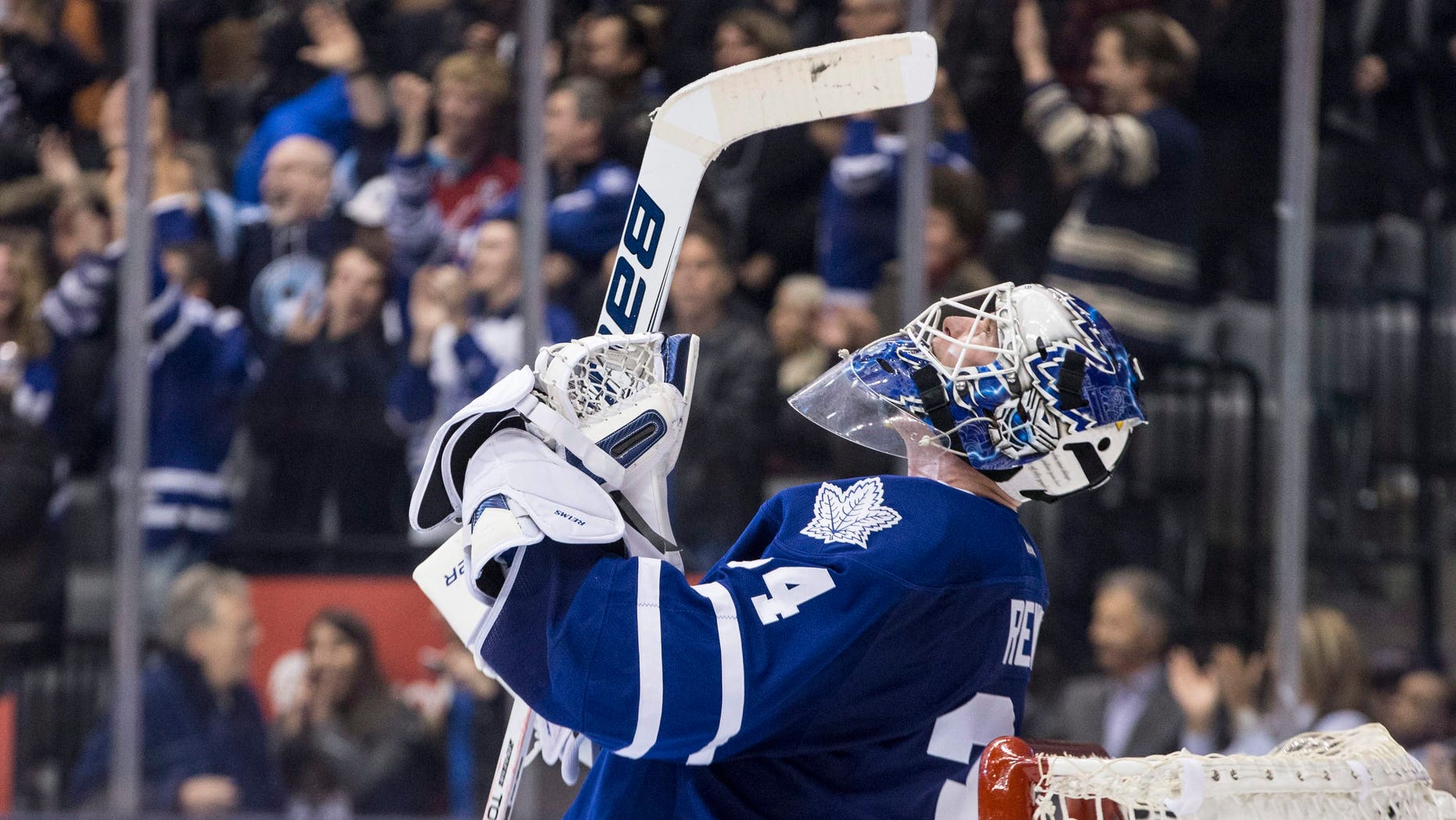 Toronto Maple Leafs goaltender James Reimer celebrates after saving a shot from Washington Capitals' Troy Brouwer to win during shootout NHL hockey action in Toronto on Saturday, Nov. 23, 2013. Toronto won 2-1. (AP Photo/The Canadian Press, Chris Young)