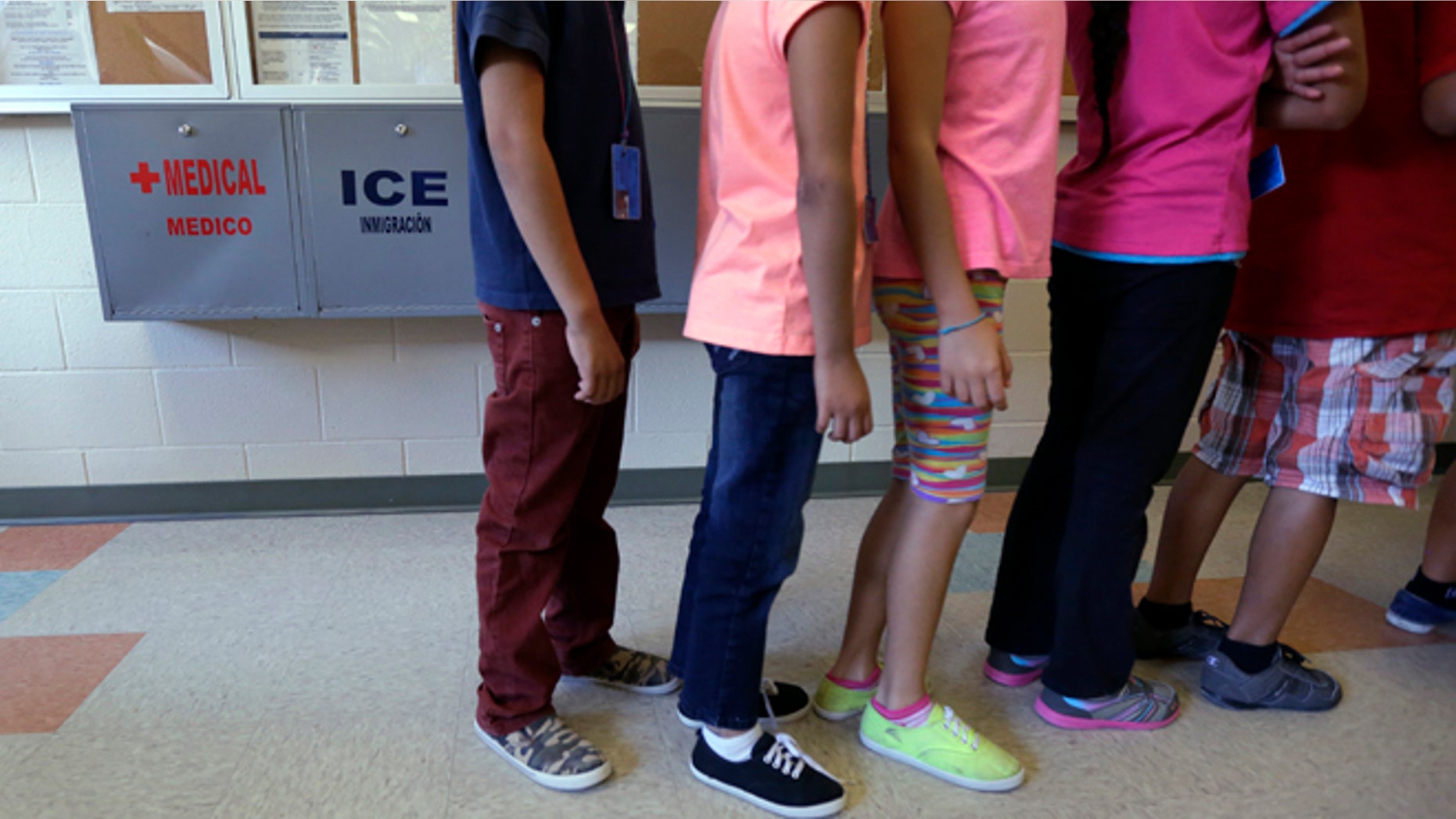 Immigrant children line up in the cafeteria at the Karnes County Residential Center in Karnes City, Texas.