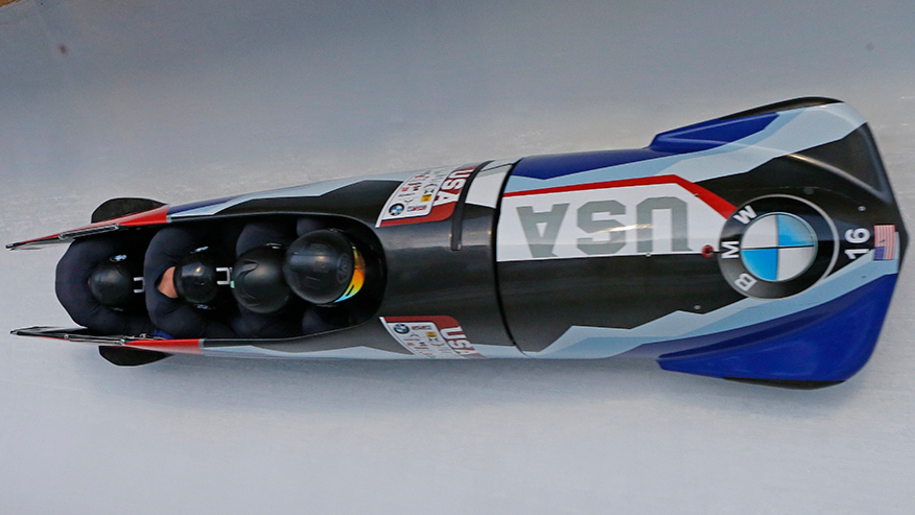 In this Nov. 18, 2017, file photo, pilot Codie Bascue, front, Nathan Weber, Carlo Valdes and Samuel McGuffie, of the United States, compete in the four-man bobsled World Cup race in Park City, Utah.