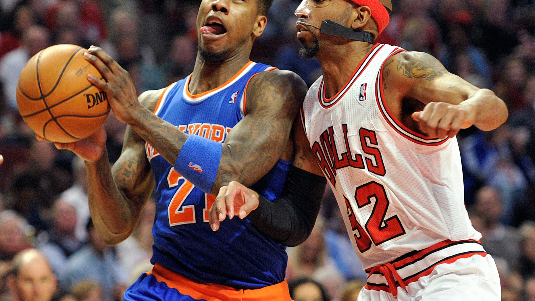 New York Knicks' Iman Shumpert drives to the basket as Chicago Bulls' Richard Hamilton (32) defends during the first half of an NBA basketball game, Thursday, April 11, 2013, in Chicago. (AP Photo/Jim Prisching)