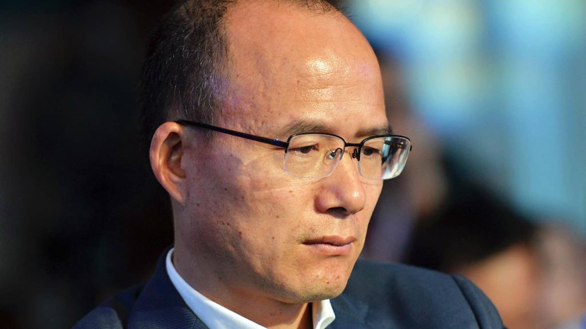 In this June 25, 2015 photo, Guo Guangchang attends the opening ceremony of the new Internet bank MYbank in Hangzhou in east China's Zhejiang province. China's biggest private conglomerate has suspended trading of its shares on Friday, Dec 11, 2015 following a report by a business magazine that its chairman Guo Guangchang, one of the country's most prominent business leaders, is missing. (Chinatopix Via AP) CHINA OUT