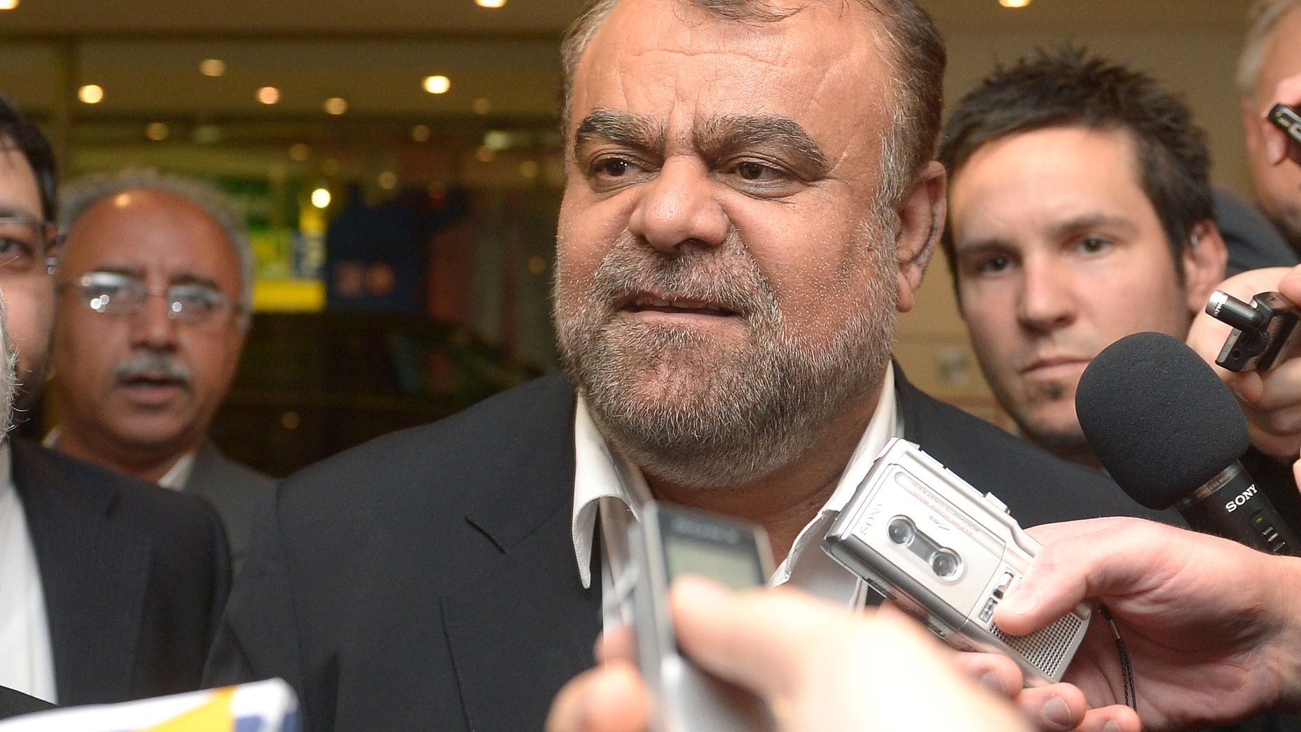 Iran's Minister of Petroleum Rostam Ghasemi talks to journalists as he arrives at a hotel for the Organization of the Petroleum Exporting Countries, OPEC, conference in Vienna, Austria, Thursday, May 30, 2012. Once the symbol of oil dominance, OPEC faces new challenges as its members gather for a ministerial meeting on how much crude to pump. For the 12 oil ministers from countries ranging from Venezuela to Nigeria and Iran, the formal focus of Friday's get-together is to determine production levels. (AP Photo/Hans Punz)